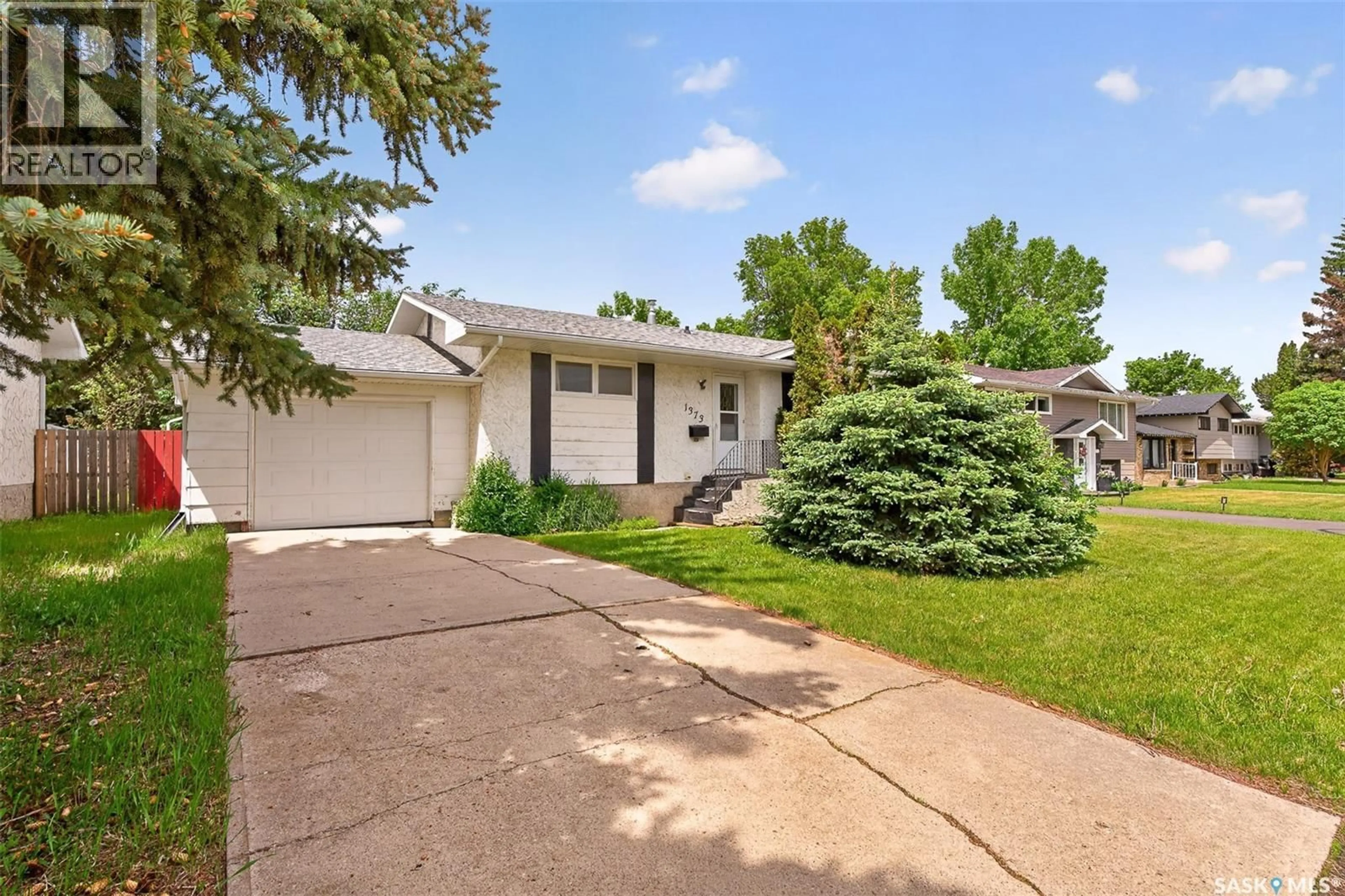 Home with vinyl exterior material, street for 1373 PRINCE CRESCENT, Moose Jaw Saskatchewan S6H6E6