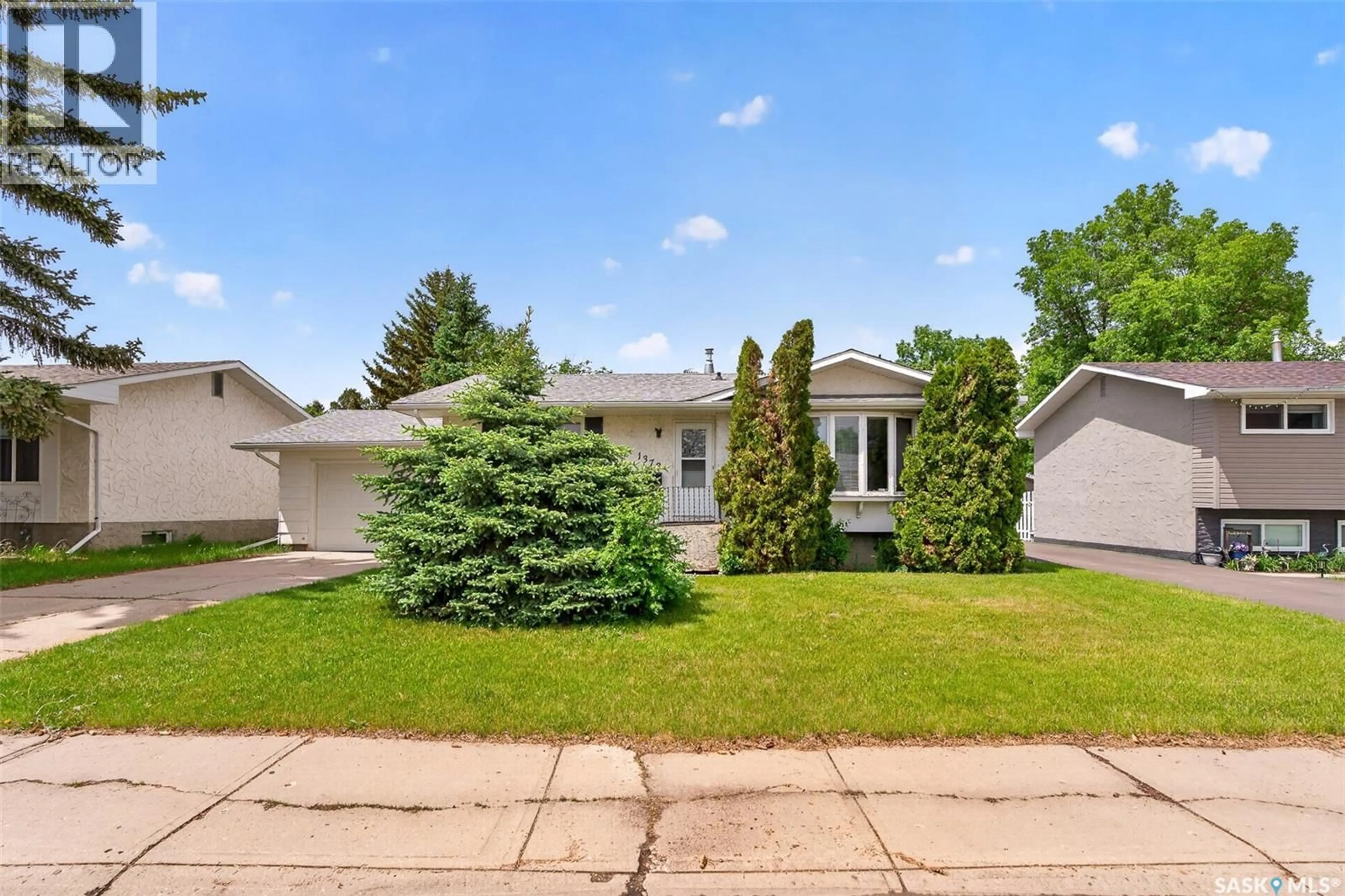 Home with vinyl exterior material, street for 1373 PRINCE CRESCENT, Moose Jaw Saskatchewan S6H6E6