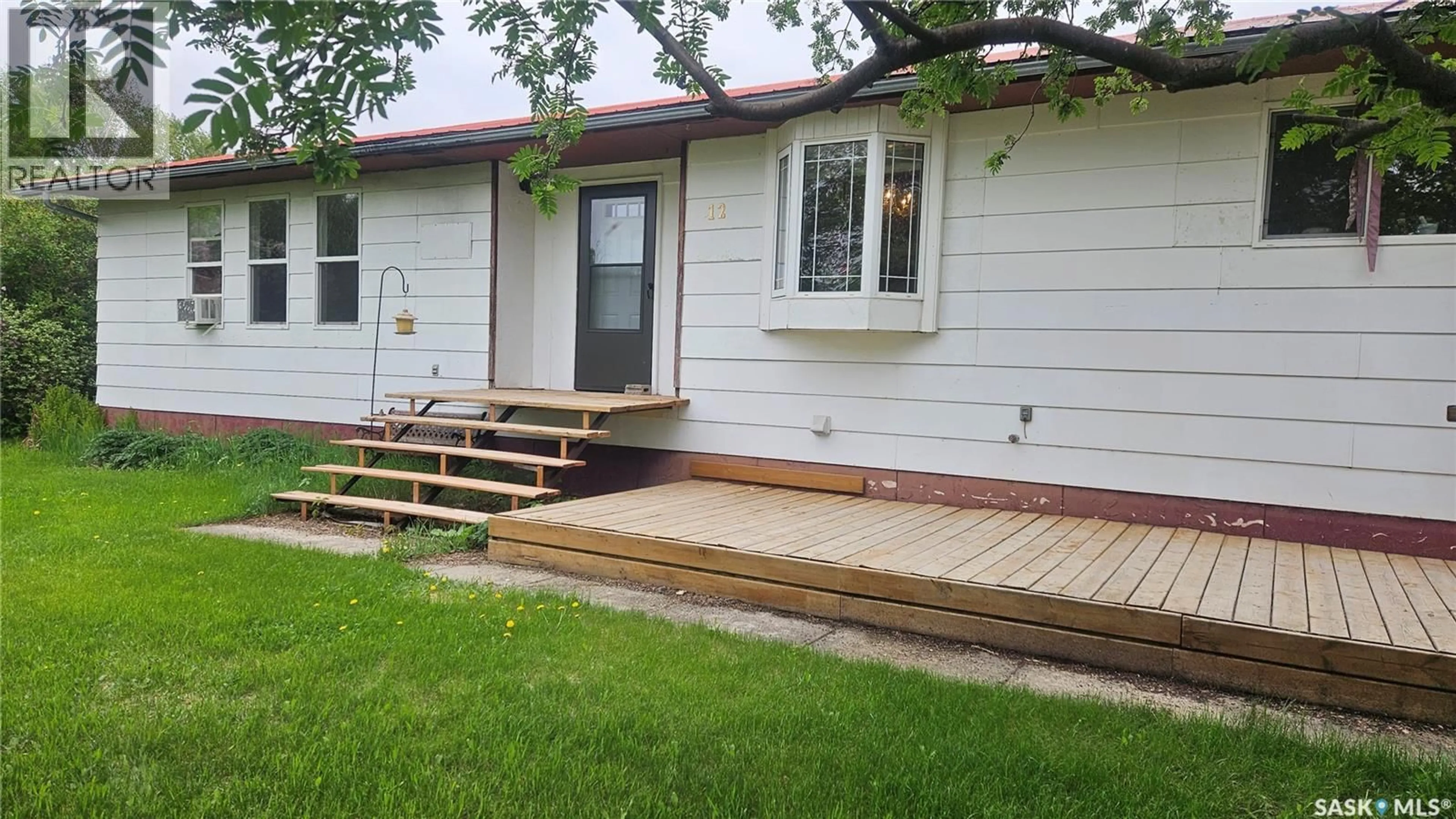 Home with vinyl exterior material, street for 12 3RD AVENUE, Weldon Saskatchewan S0K3J0