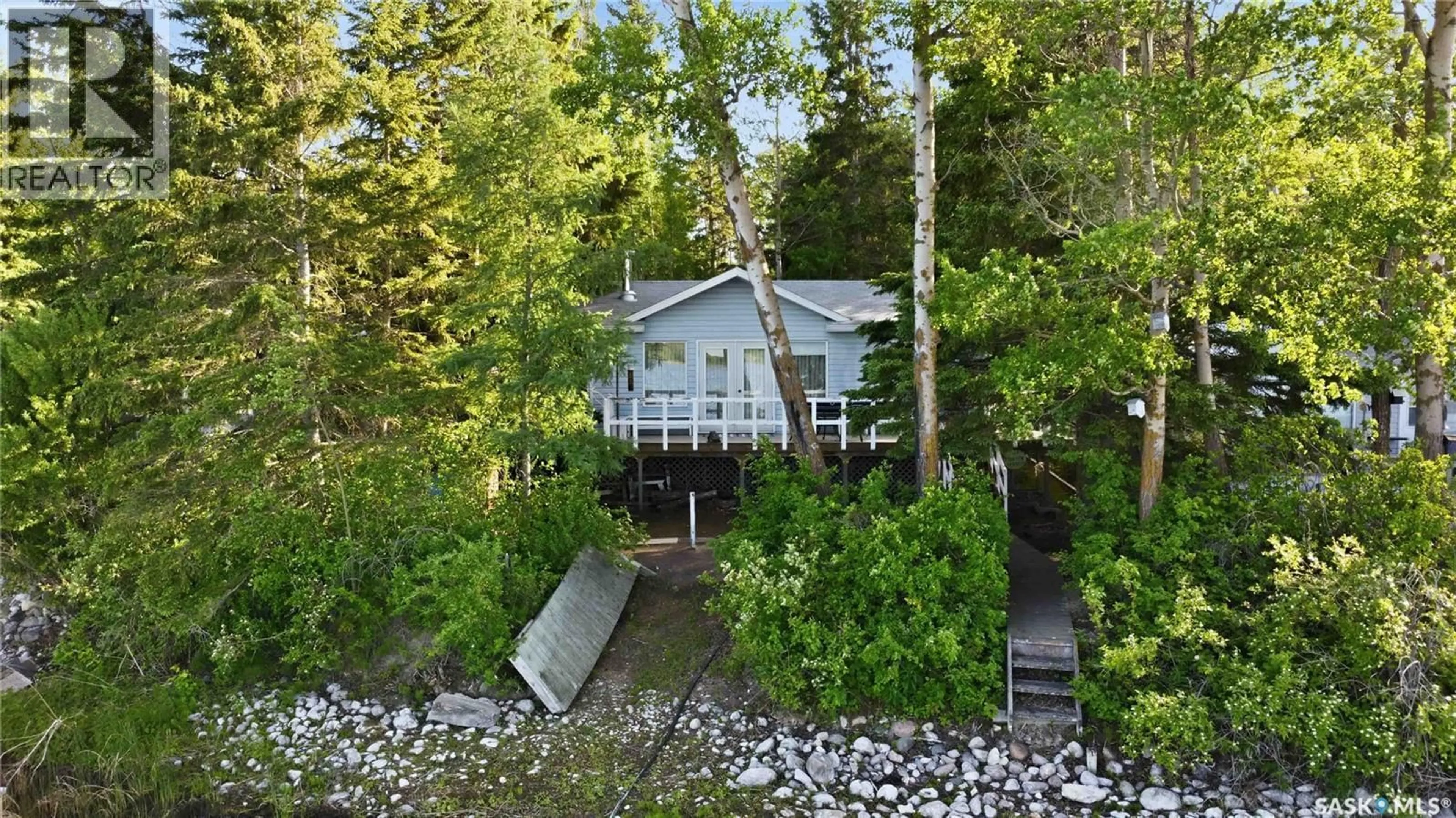 A pic from outside/outdoor area/front of a property/back of a property/a pic from drone, forest/trees view for 9 WOODLAND AVENUE, Lac la Pêche Saskatchewan S0J2G0