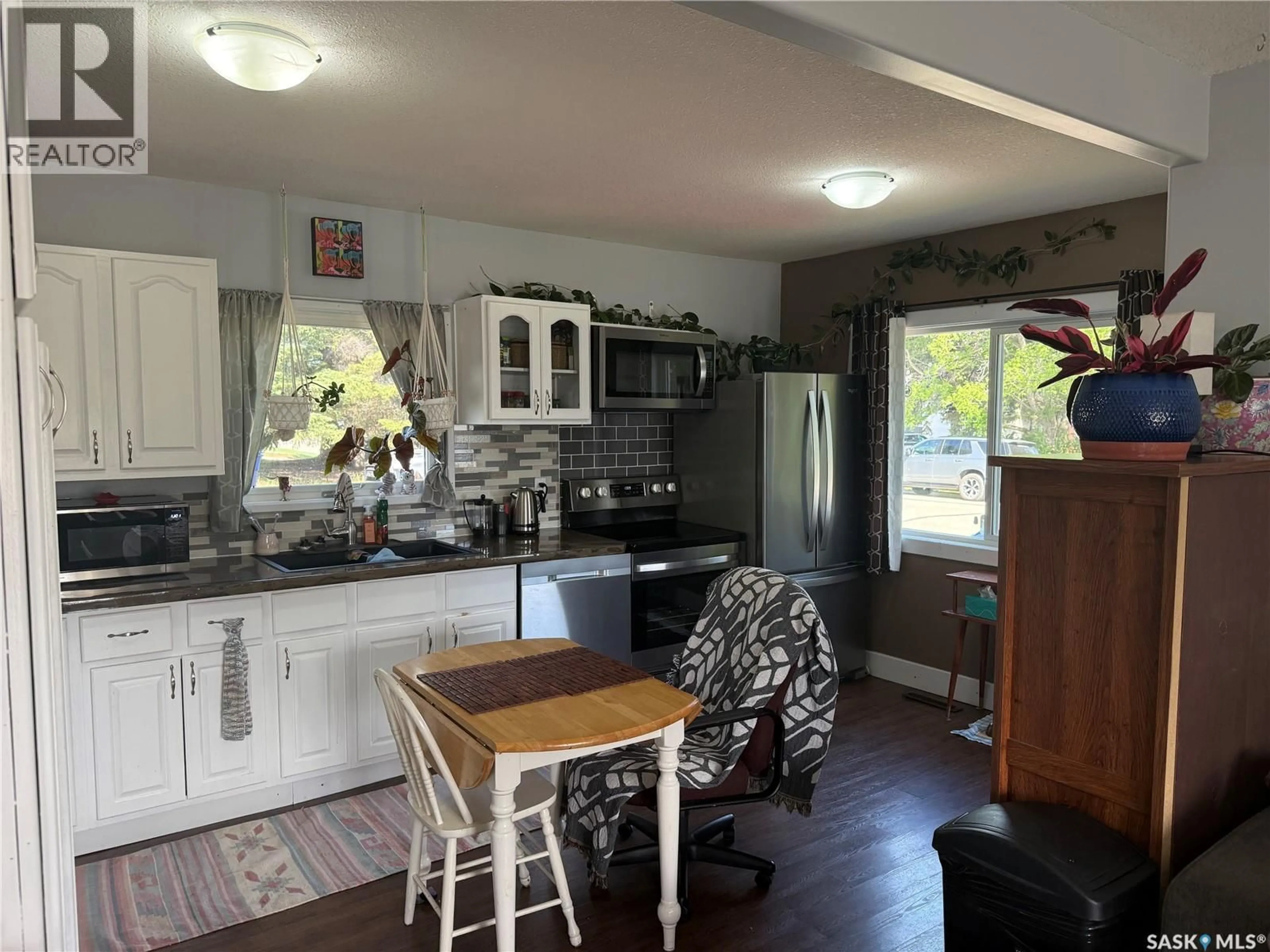 Open concept kitchen, wood/laminate floor for 300 8TH AVENUE, Nipawin Saskatchewan S0E1E0