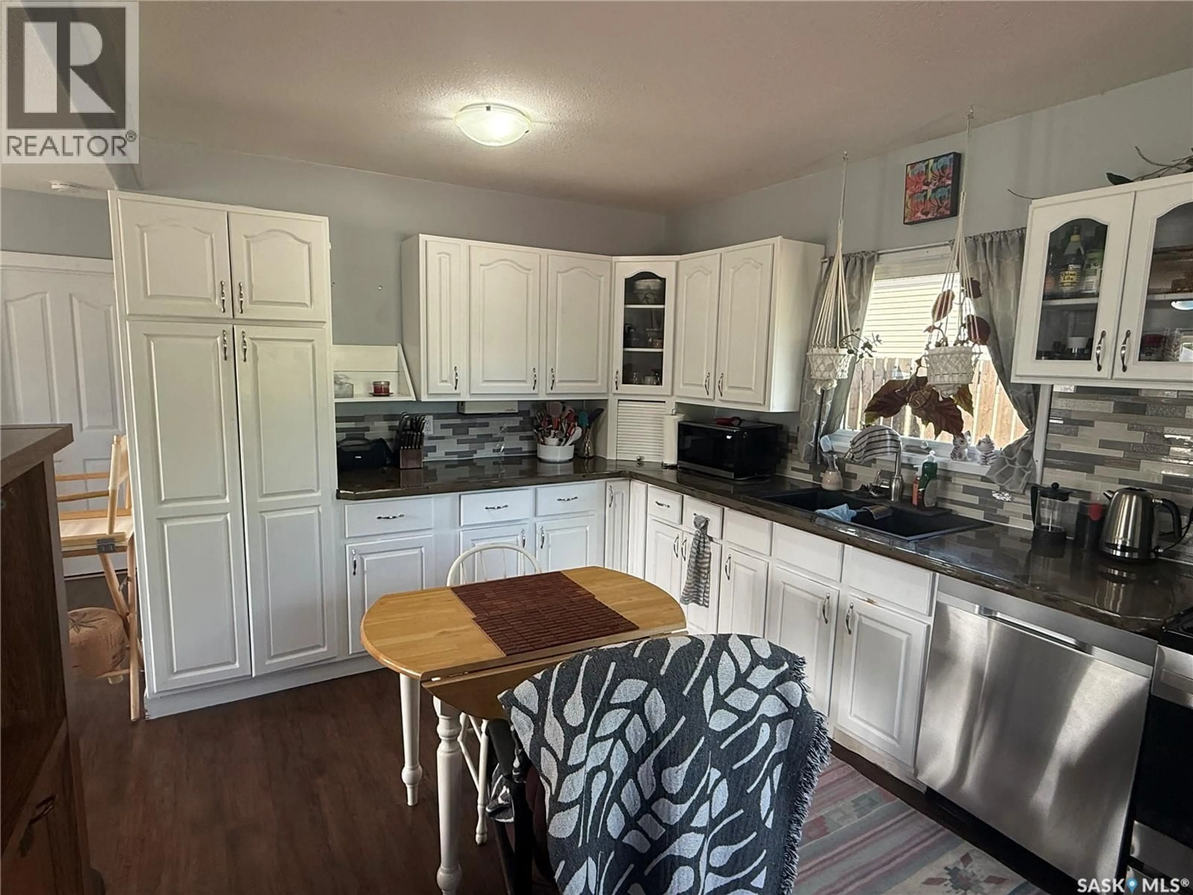 Open concept kitchen, wood/laminate floor for 300 8TH AVENUE, Nipawin Saskatchewan S0E1E0