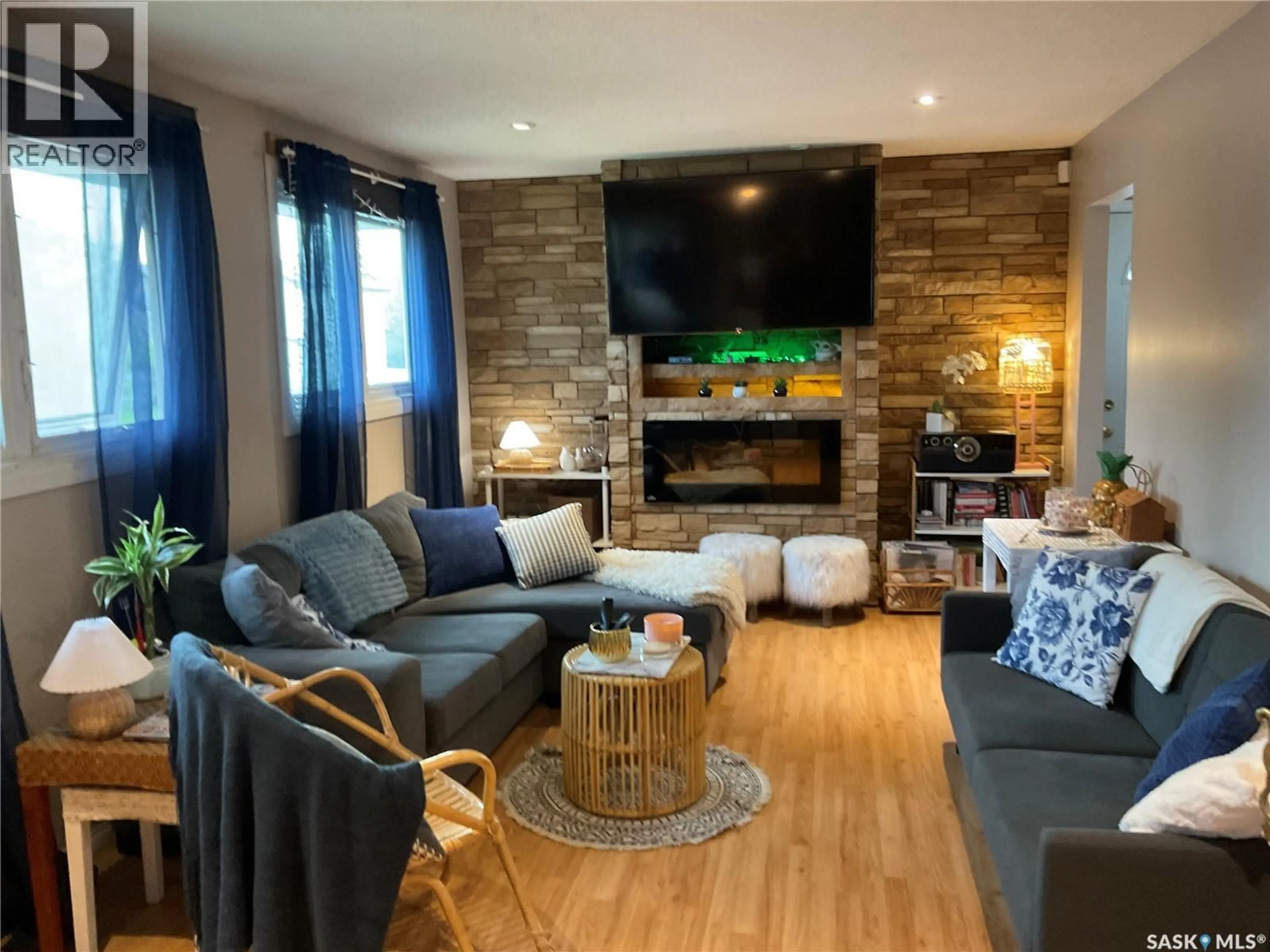 Living room with furniture, wood/laminate floor for 302 DUNLOP STREET, Saskatoon Saskatchewan S7N2P7
