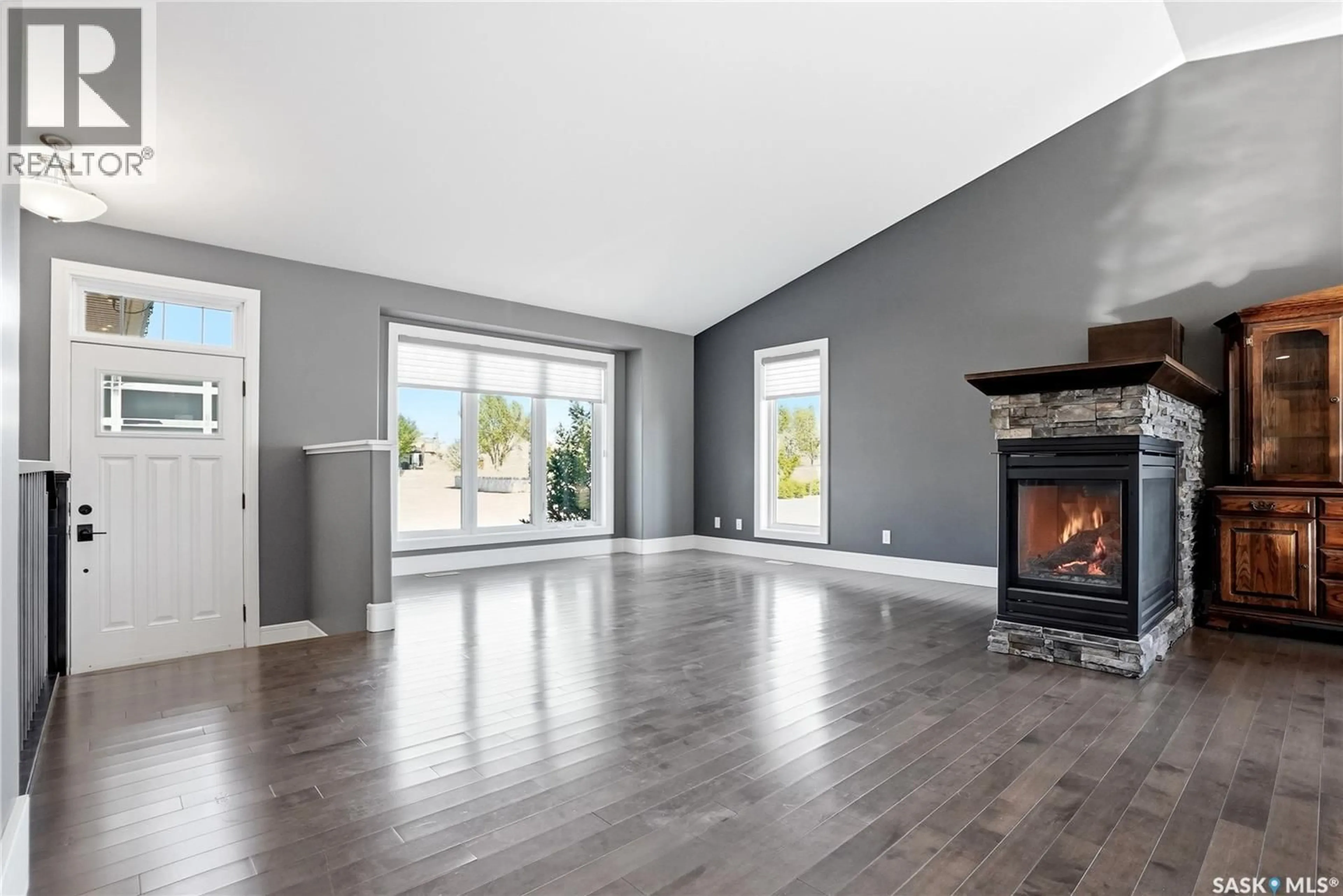 Living room with furniture, wood/laminate floor for 326 HORLICK CRESCENT, Saskatoon Saskatchewan S7N4R5