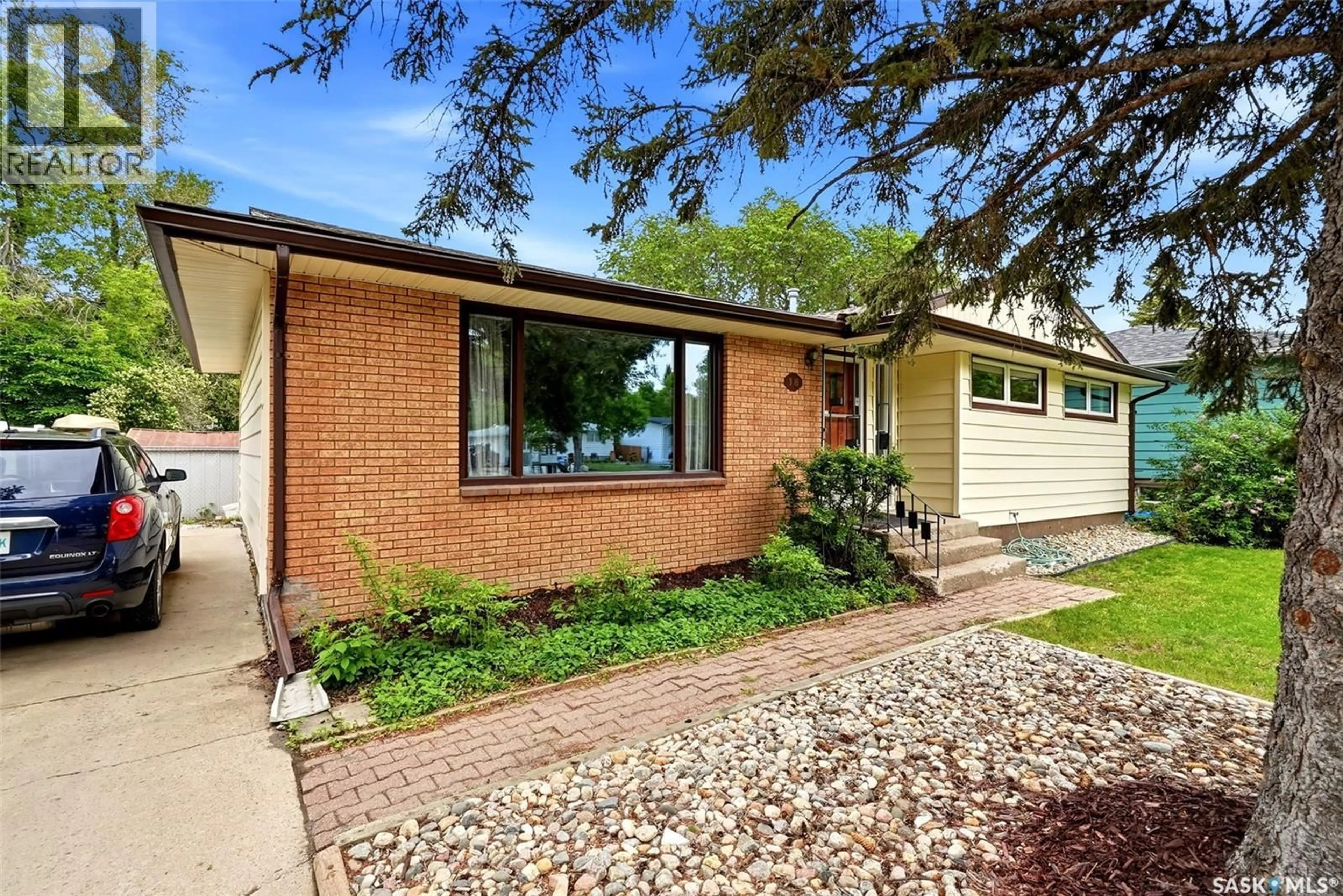 Home with brick exterior material, street for 18 BOLE PLACE, Regina Saskatchewan S4S3W7