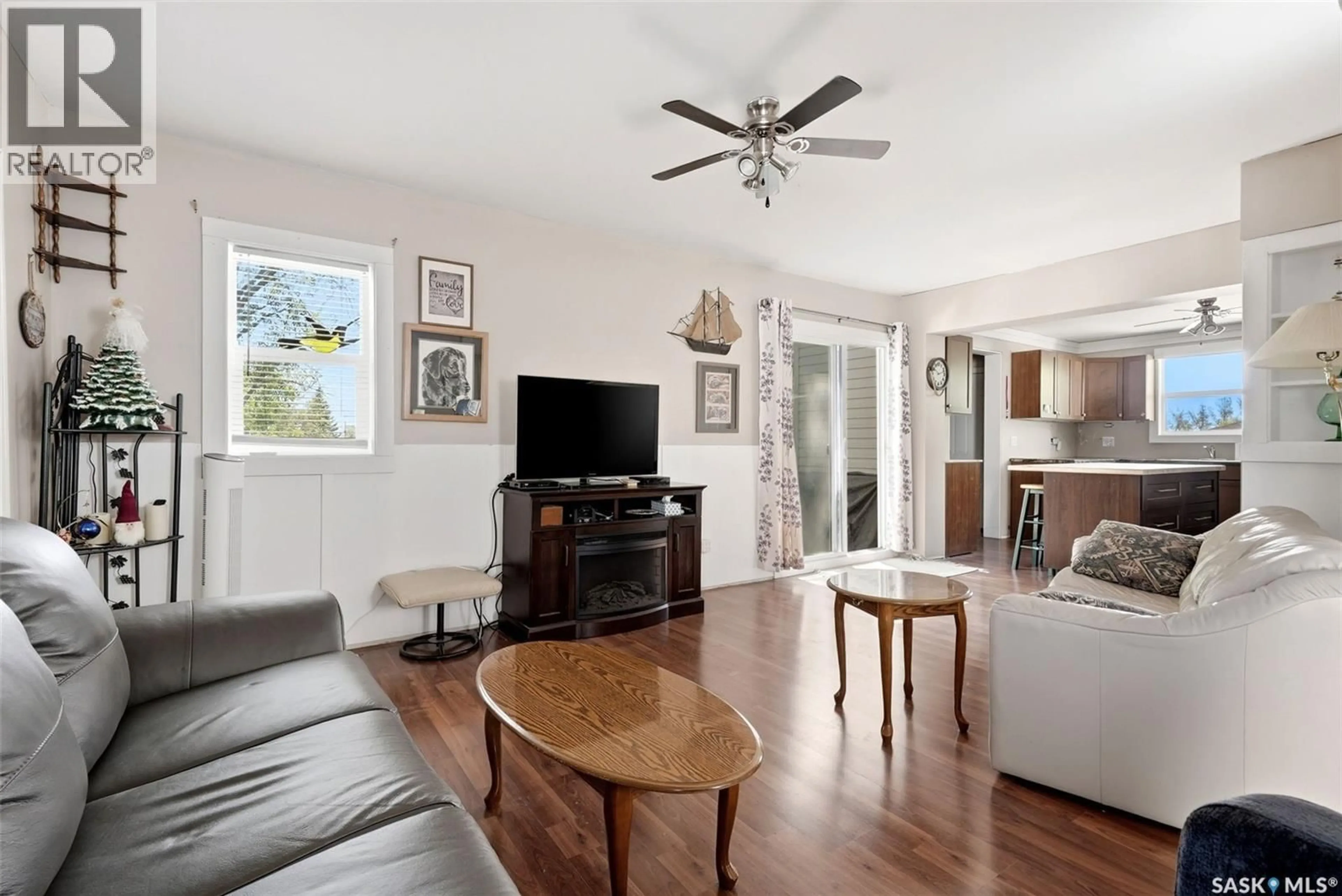 Living room with furniture, wood/laminate floor for 228 NICOLL AVENUE, Regina Beach Saskatchewan S0G4C0