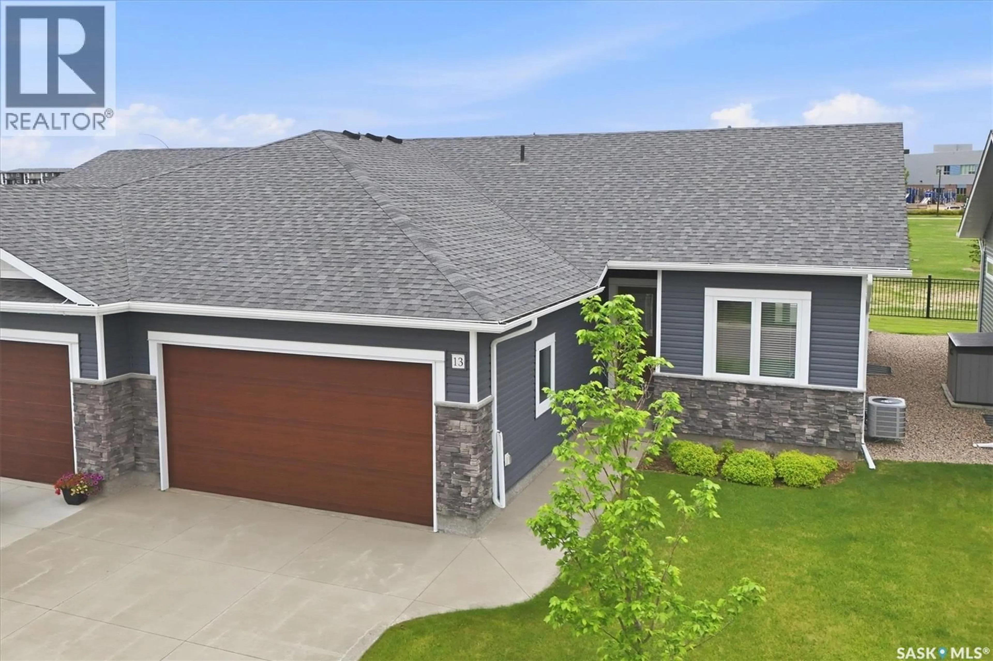 A pic from outside/outdoor area/front of a property/back of a property/a pic from drone, street for W - 13 315 OLSON LANE, Saskatoon Saskatchewan S7V0R8