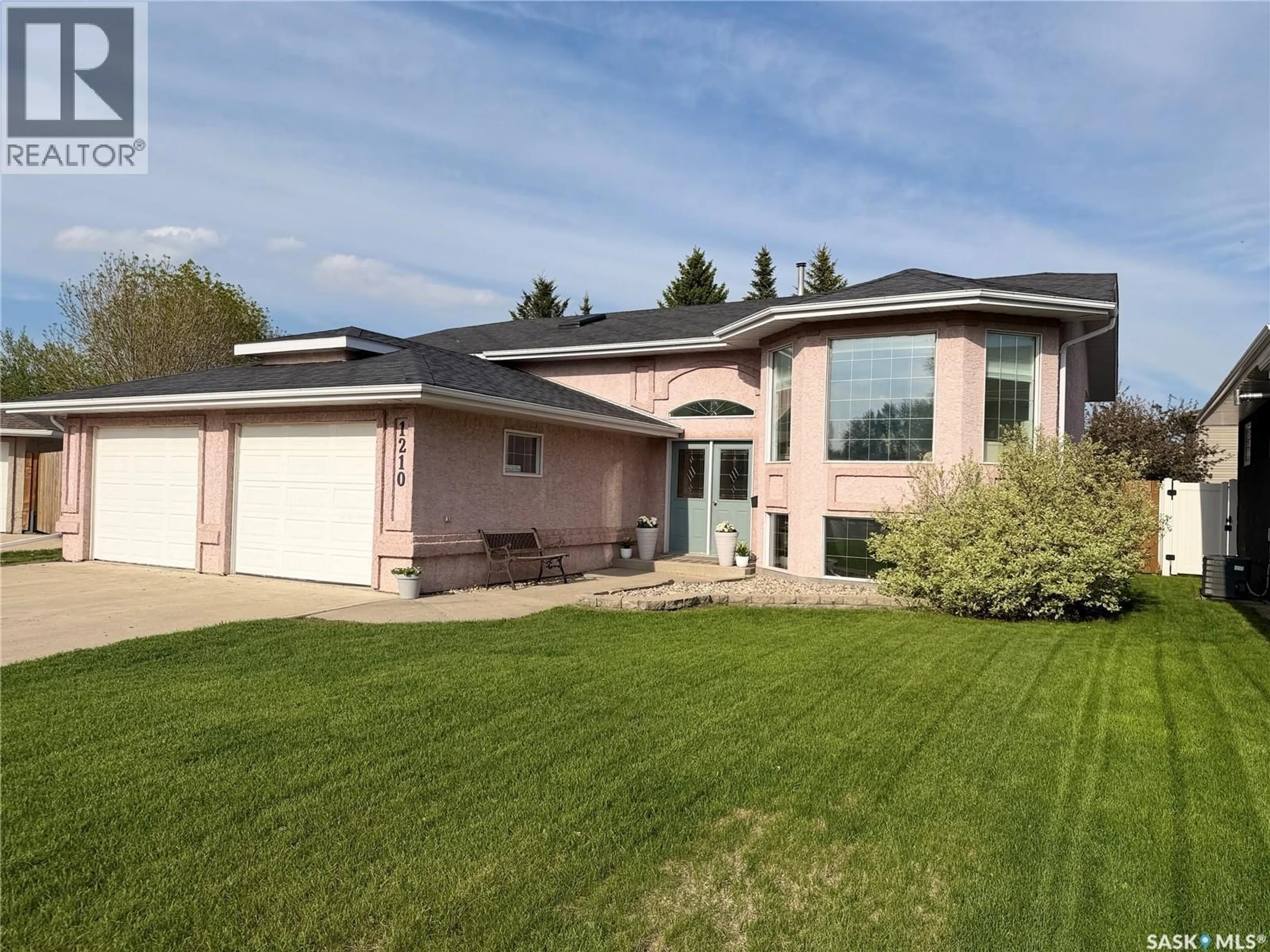 Home with vinyl exterior material, street for 1210 FLORY PLACE, Humboldt Saskatchewan S0K2A0