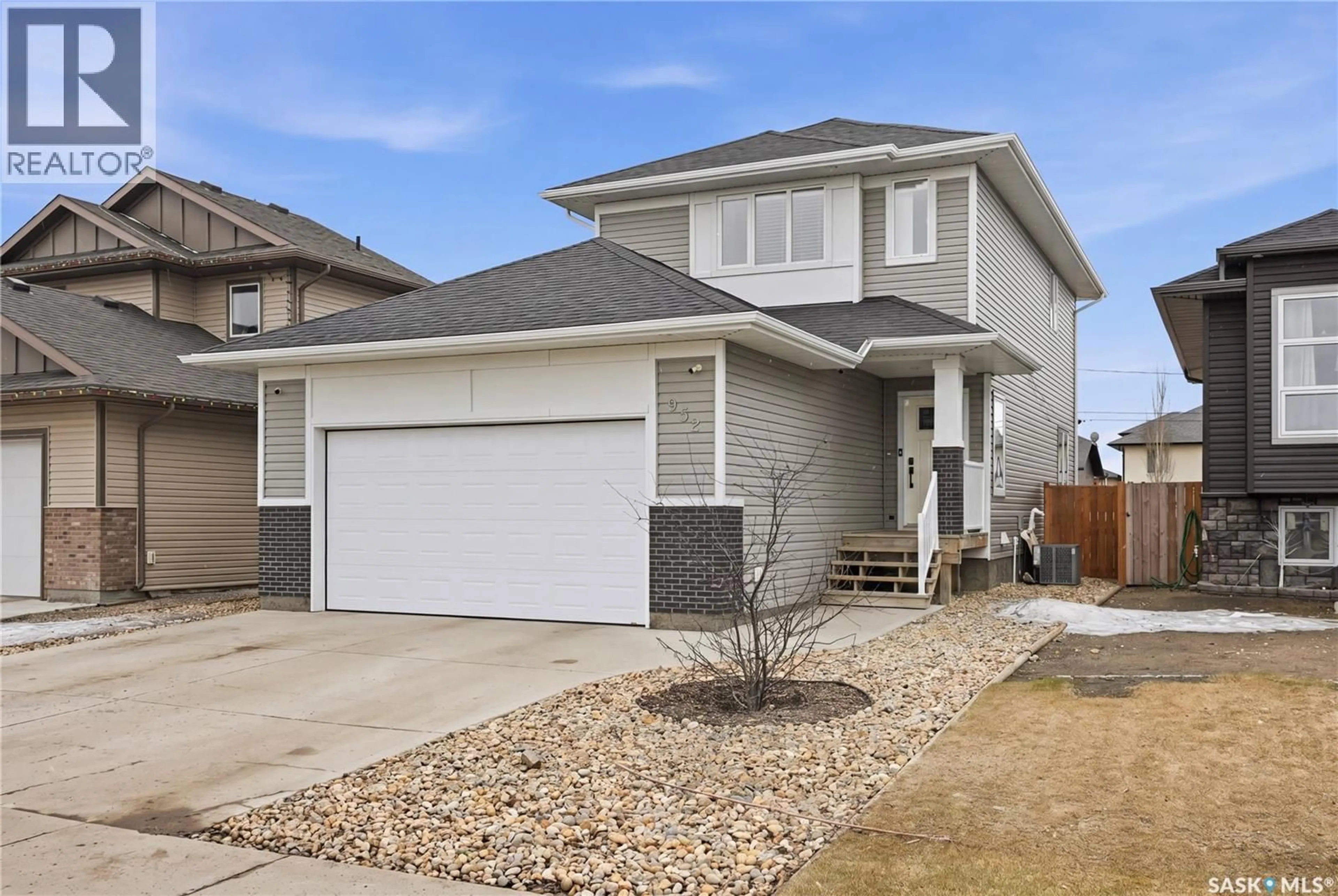 Home with vinyl exterior material, street for 932 ROCK HILL LANE, Martensville Saskatchewan S0K2T1
