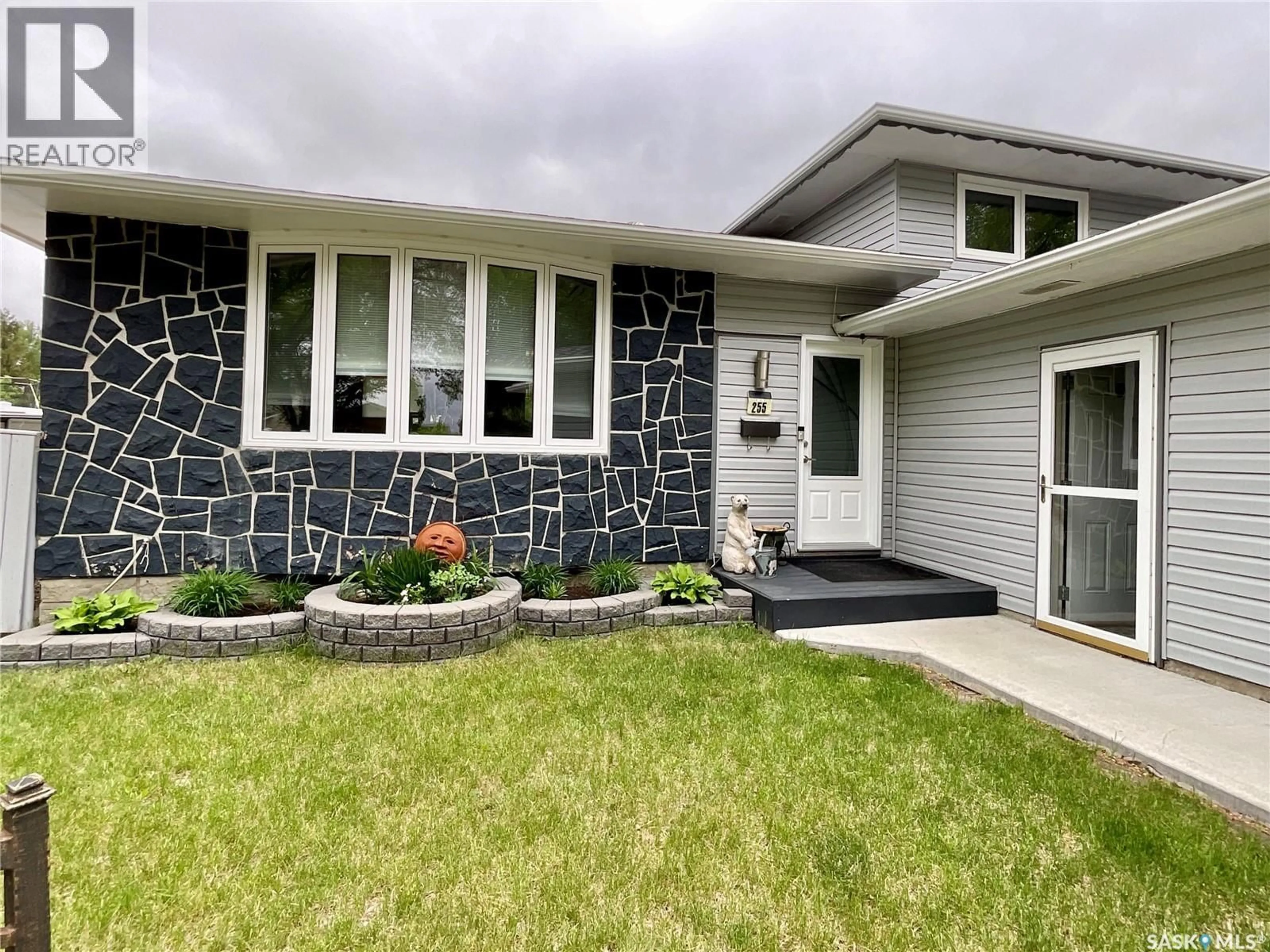 Home with vinyl exterior material, street for 255 LITZENBERGER CRESCENT, Regina Saskatchewan S4R7A2