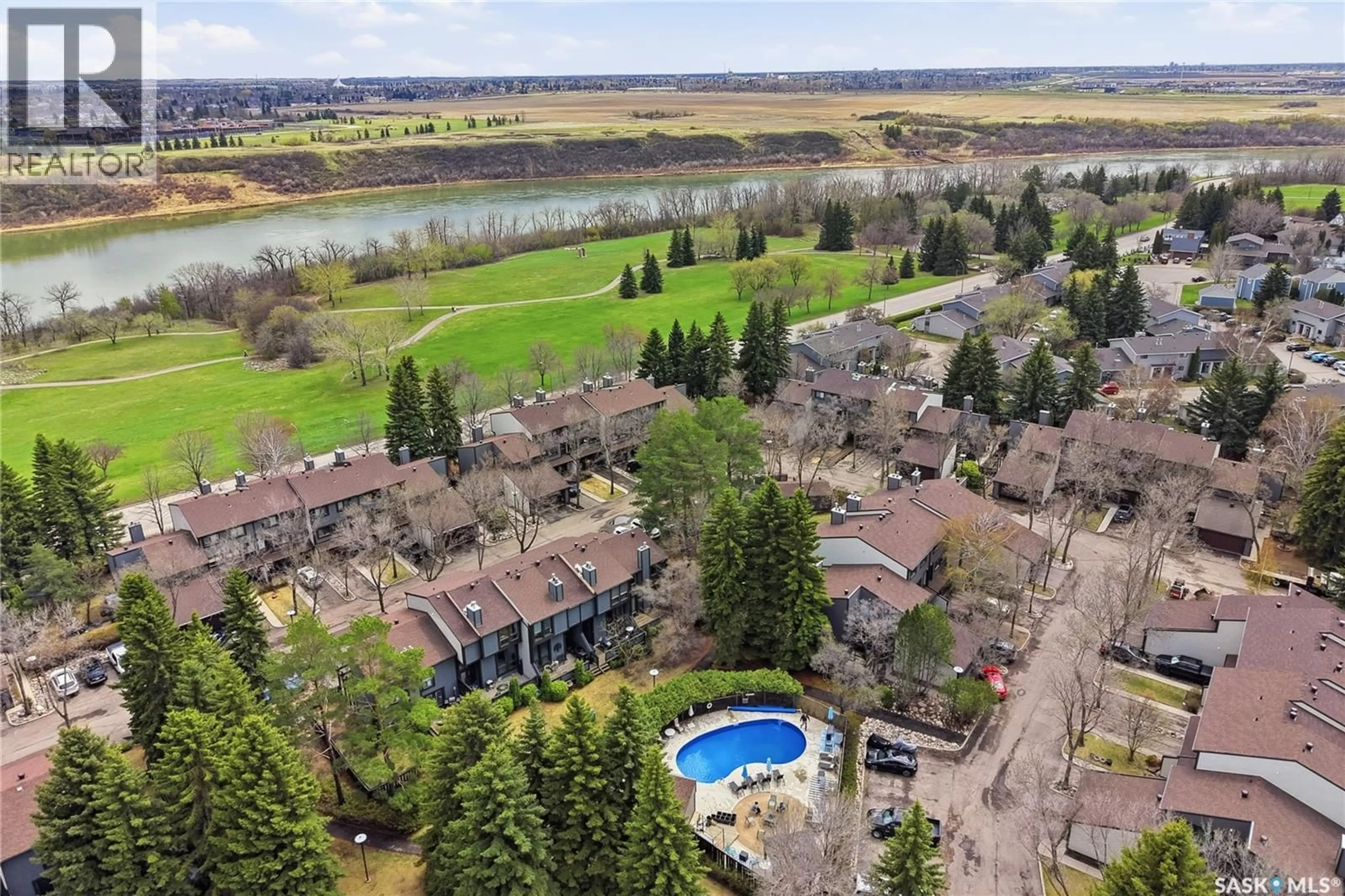 A pic from outside/outdoor area/front of a property/back of a property/a pic from drone, water/lake/river/ocean view for 20 455 PINEHOUSE DRIVE, Saskatoon Saskatchewan S7K5X1