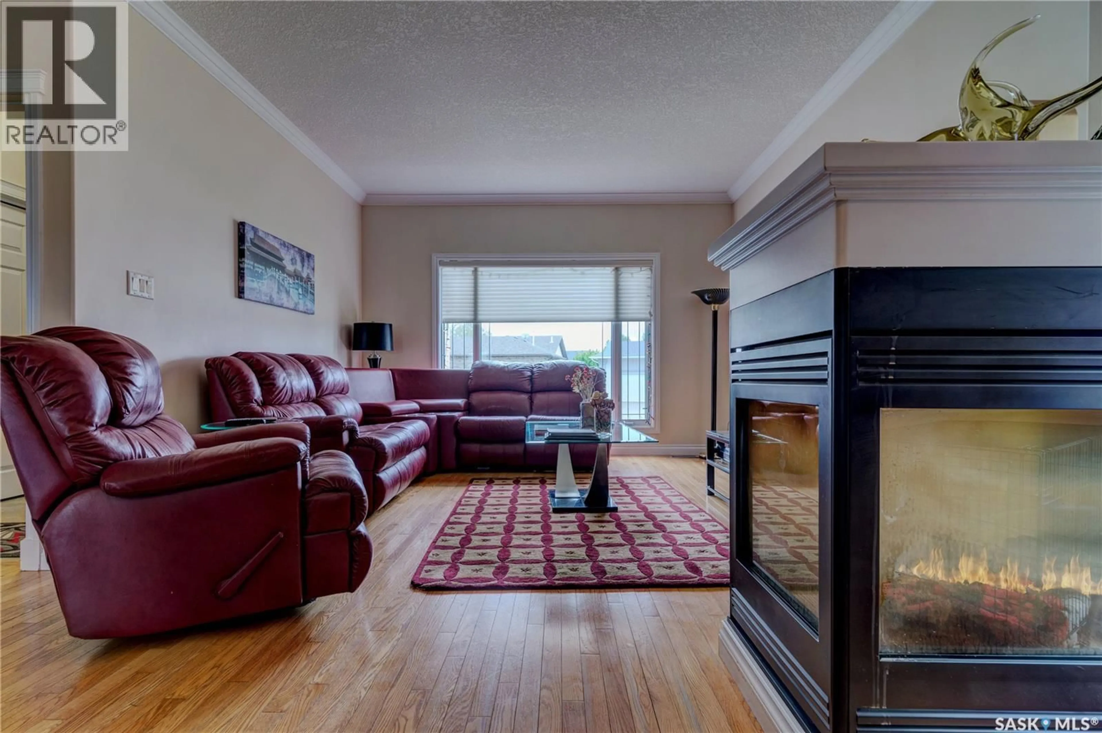 Living room with furniture, wood/laminate floor for 3511 BISHOP CRESCENT, Regina Saskatchewan S4Z1A6