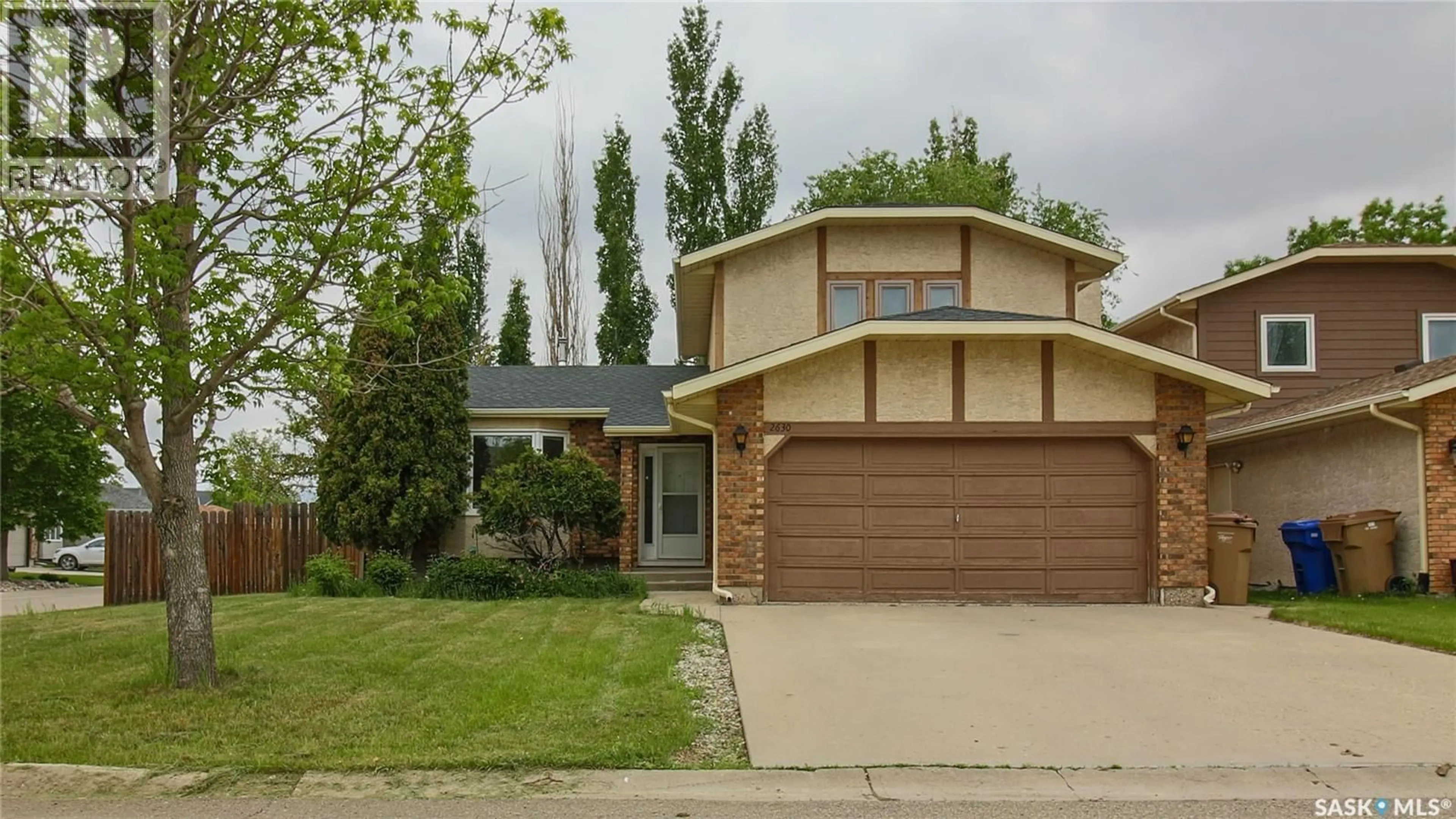 Home with brick exterior material, street for 2630 CROCUS DRIVE, Regina Saskatchewan S4V1S8