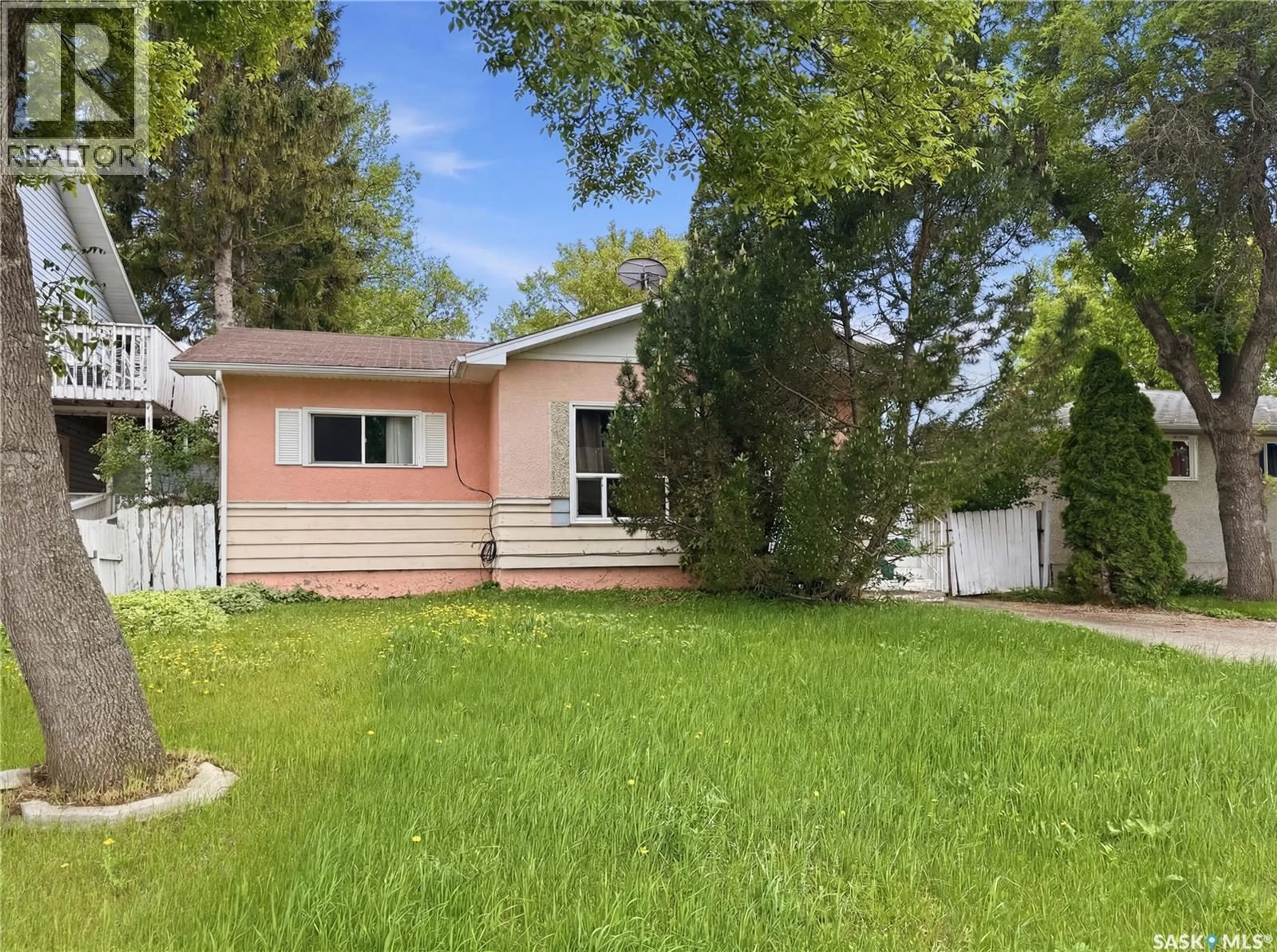 Home with vinyl exterior material, street for 1041 3RD STREET, Prince Albert Saskatchewan S6V0J4