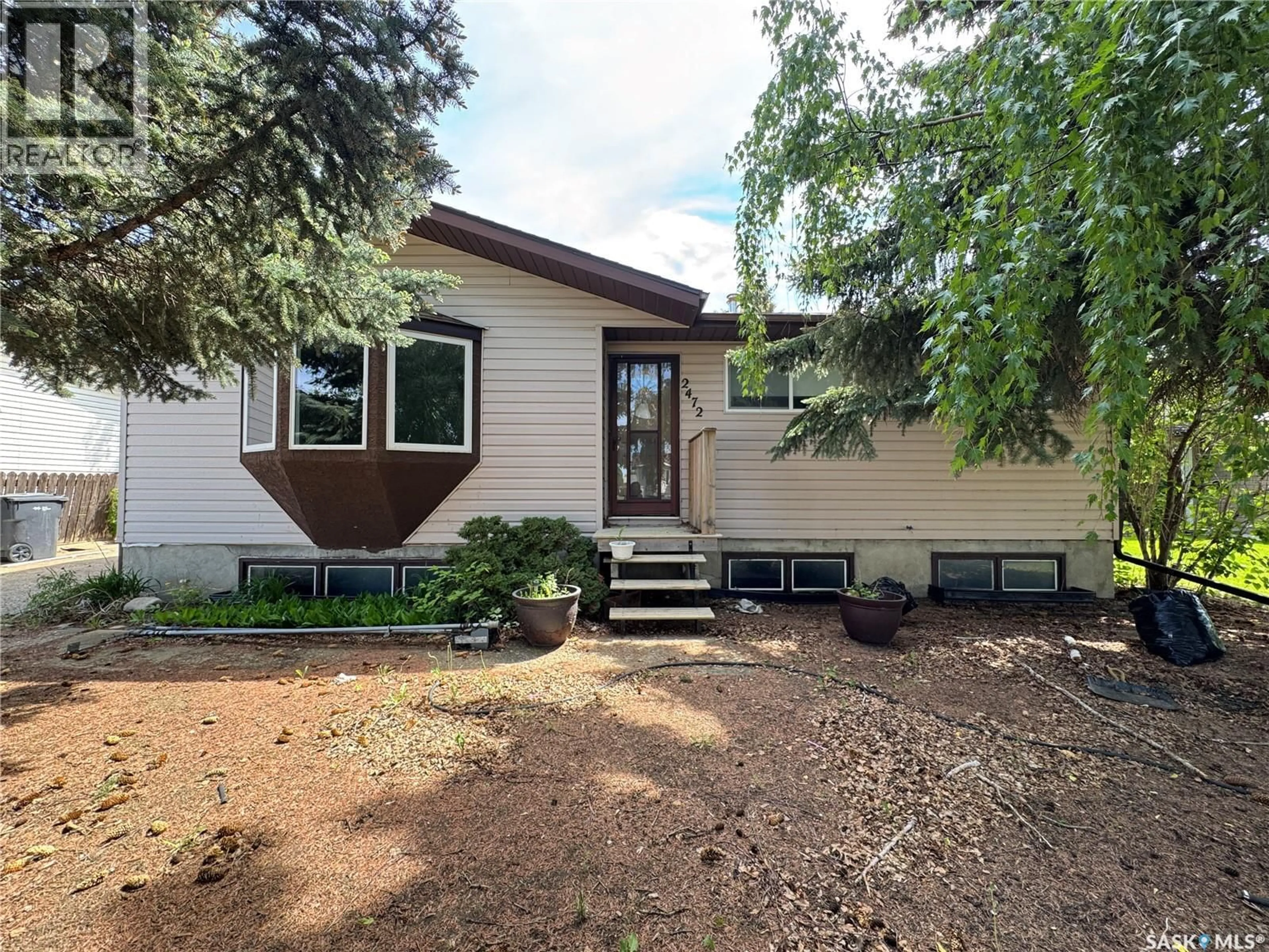 Home with vinyl exterior material, street for 2472 ROSS CRESCENT, North Battleford Saskatchewan S9A3R3