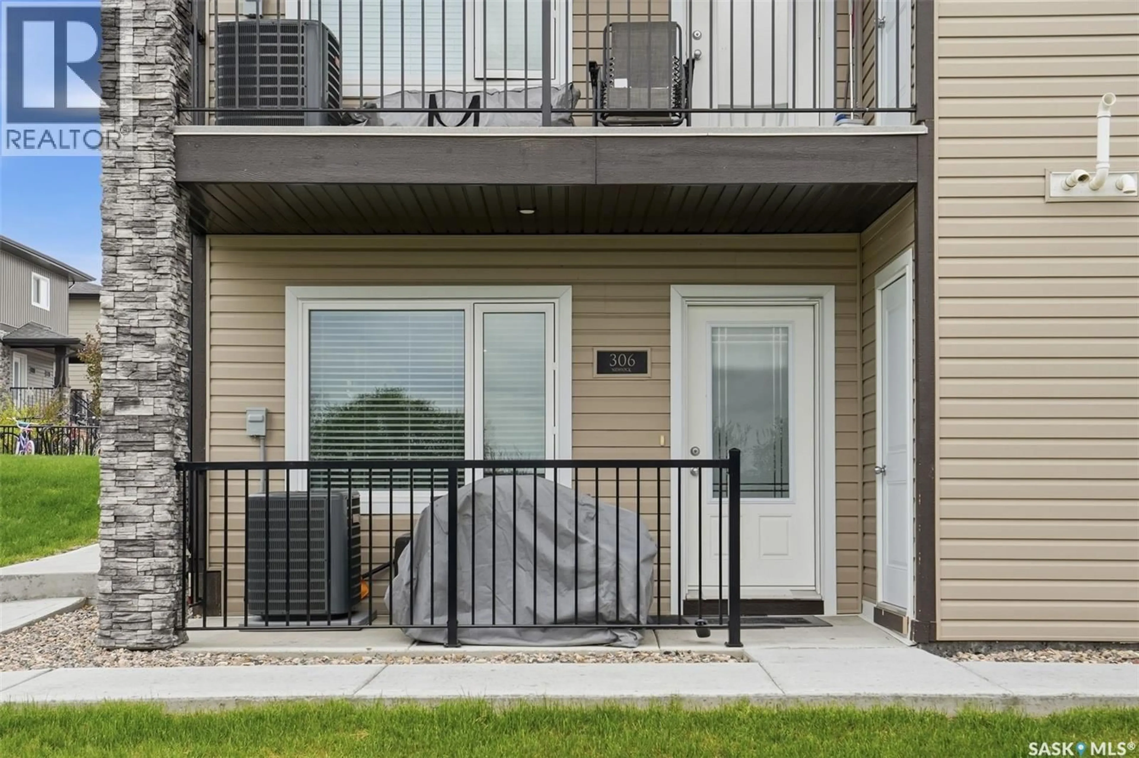 Patio, water/lake/river/ocean view for 306 - 110 AKHTAR BEND, Saskatoon Saskatchewan S7W0Y9