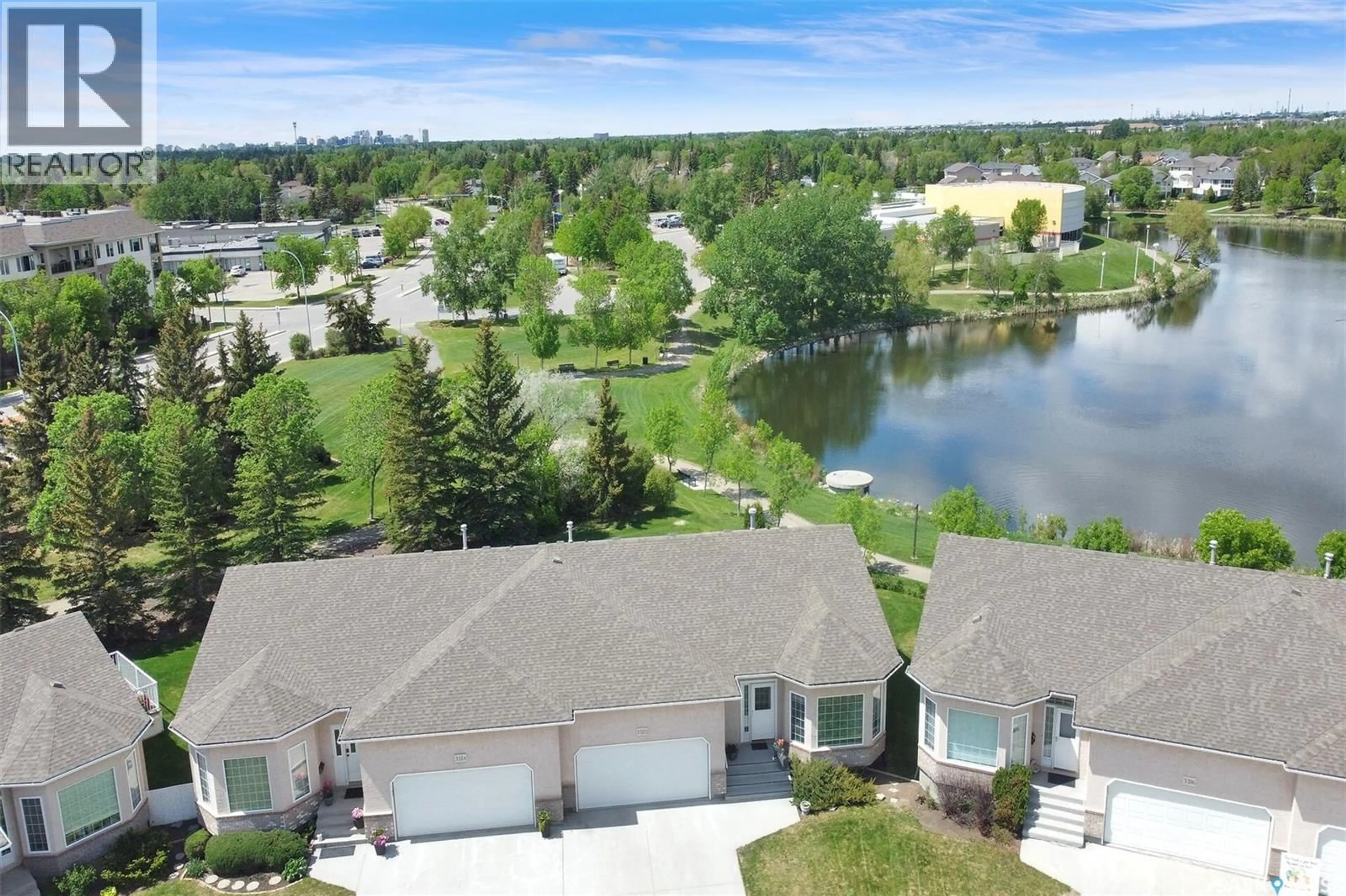 A pic from outside/outdoor area/front of a property/back of a property/a pic from drone, water/lake/river/ocean view for E - 3320 BUCKINGHAM DRIVE, Regina Saskatchewan S4V2S8