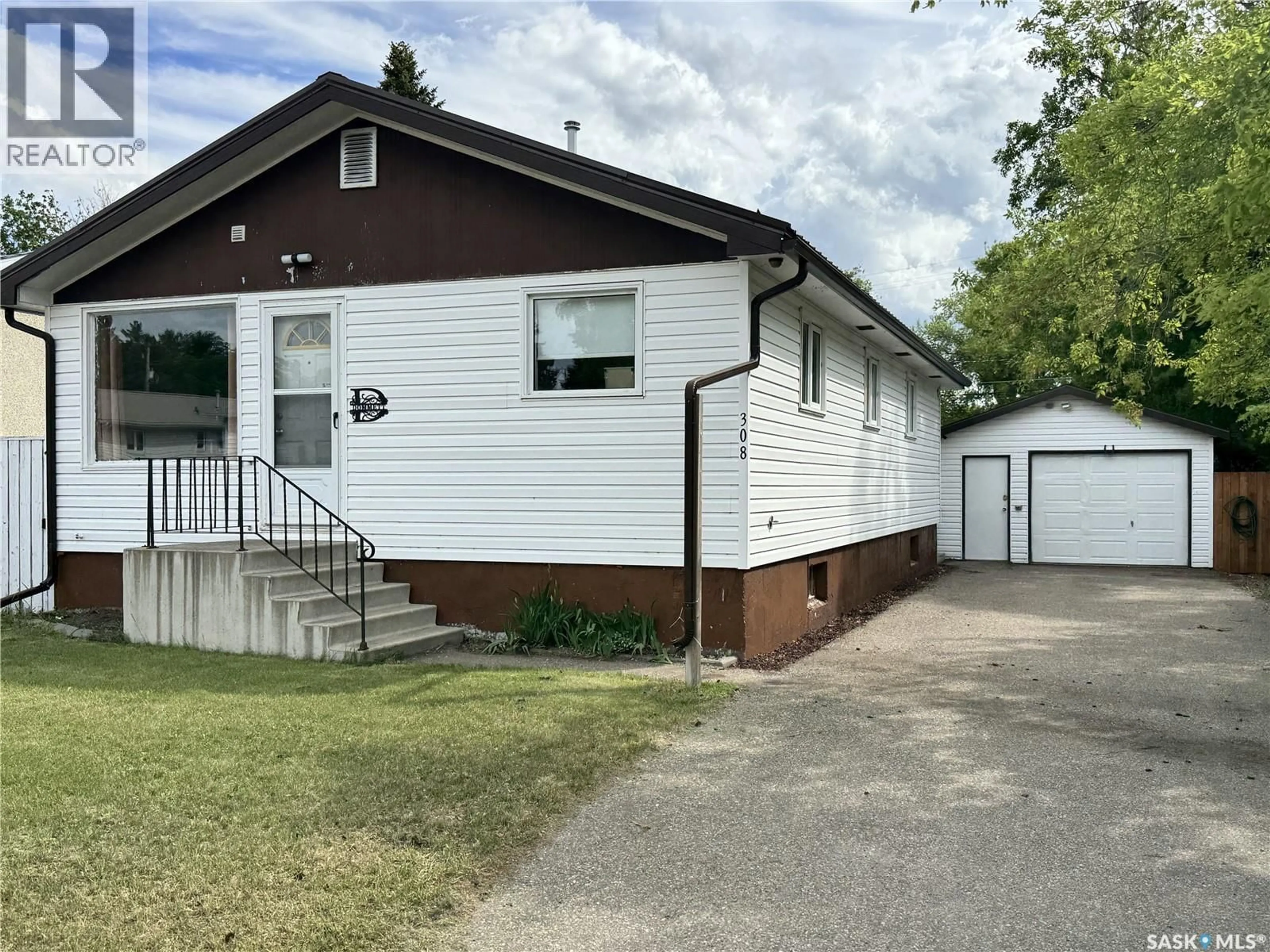 Home with vinyl exterior material, street for 308 7TH AVENUE, Biggar Saskatchewan S0K0M0