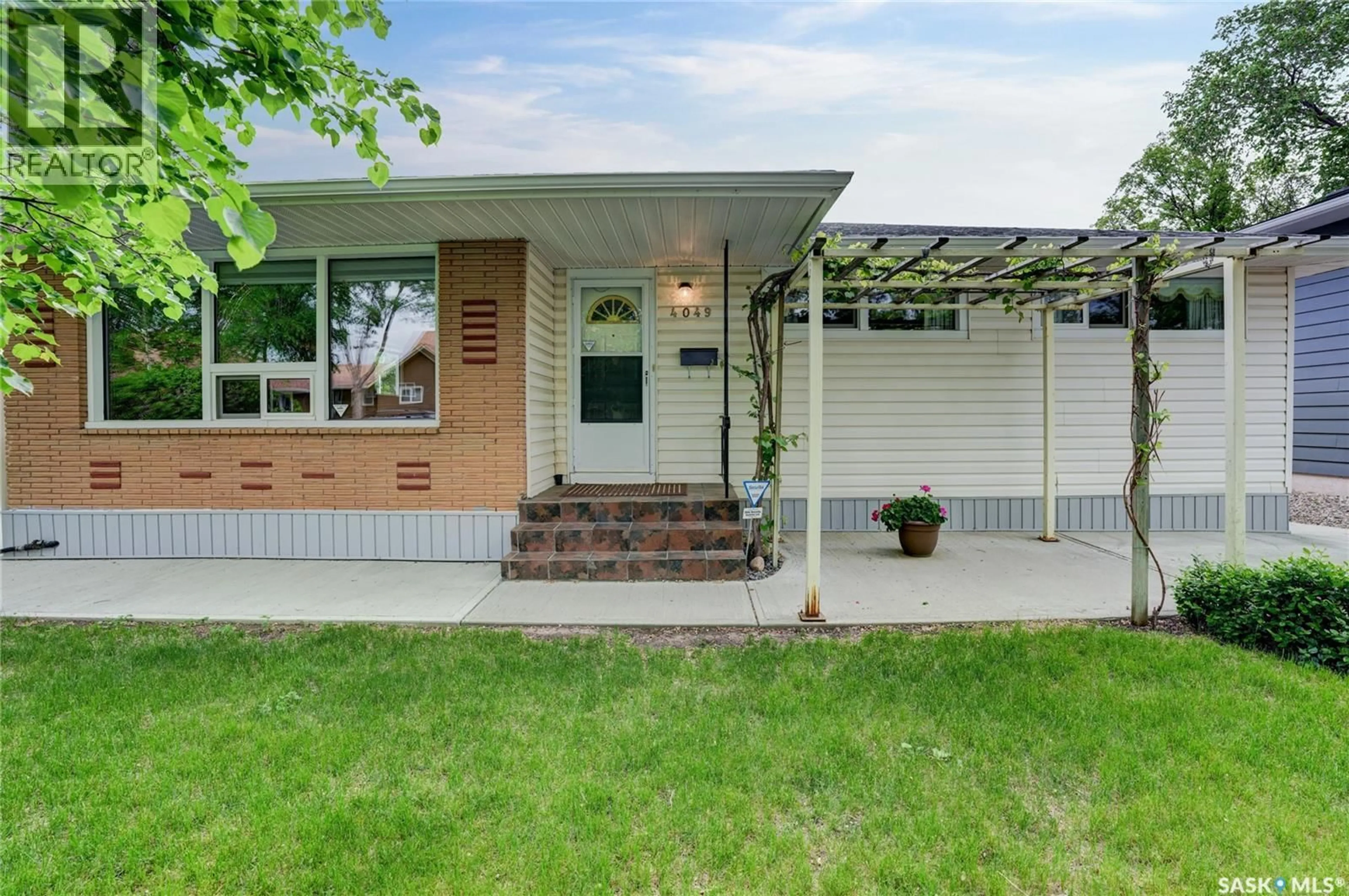 Home with vinyl exterior material, street for 4049 GARNET STREET, Regina Saskatchewan S4S3G8