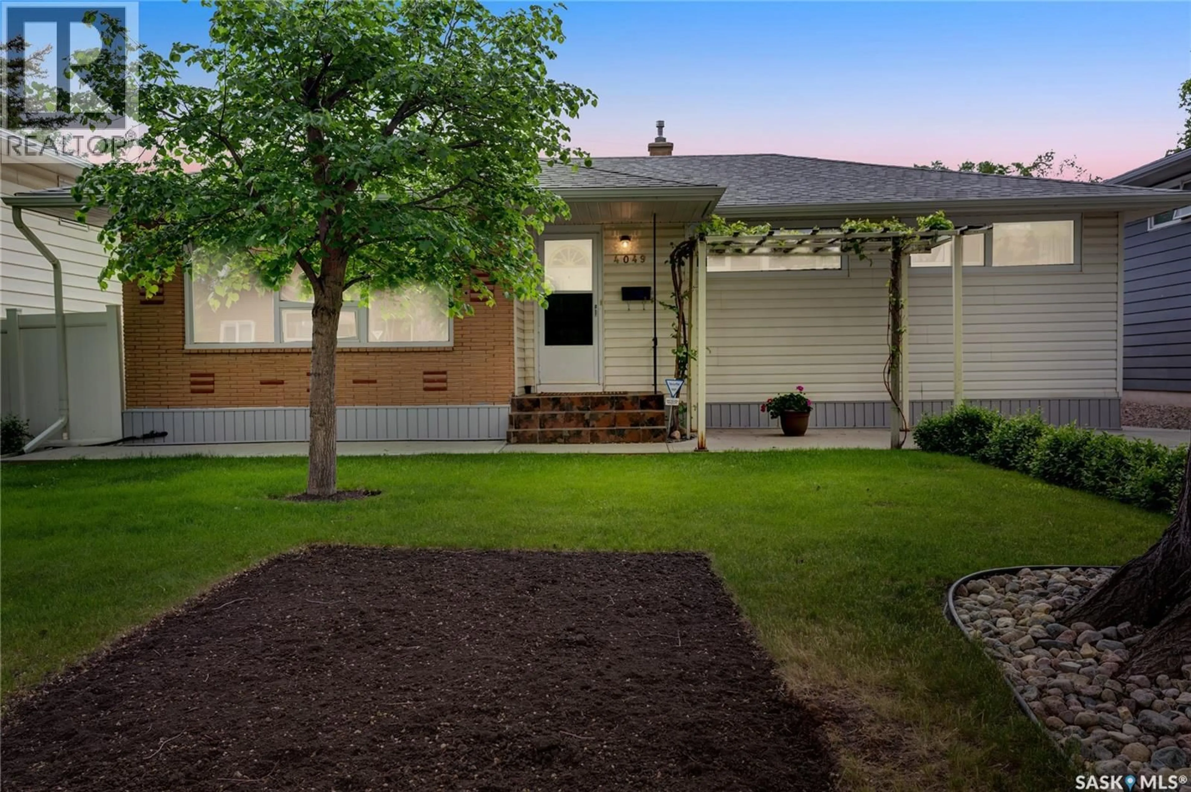 Home with vinyl exterior material, street for 4049 GARNET STREET, Regina Saskatchewan S4S3G8