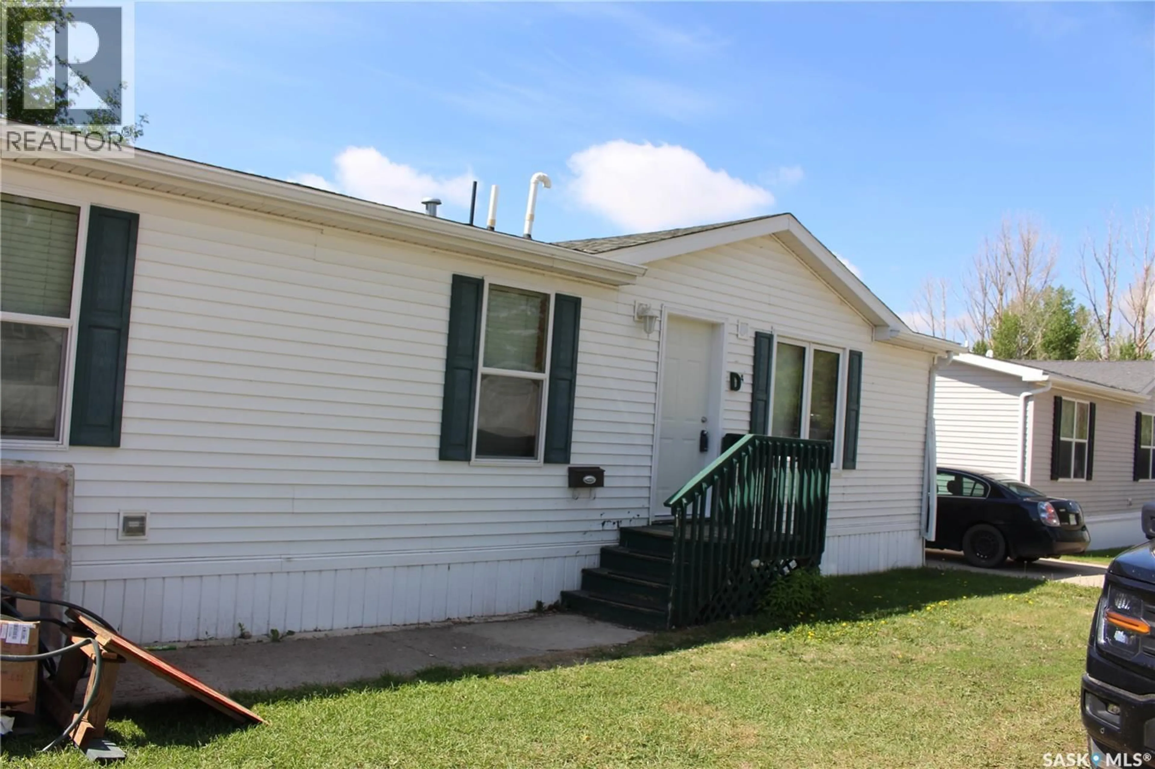 Home with vinyl exterior material, street for D4 - 1295 9TH AVENUE, Moose Jaw Saskatchewan S6J1C5
