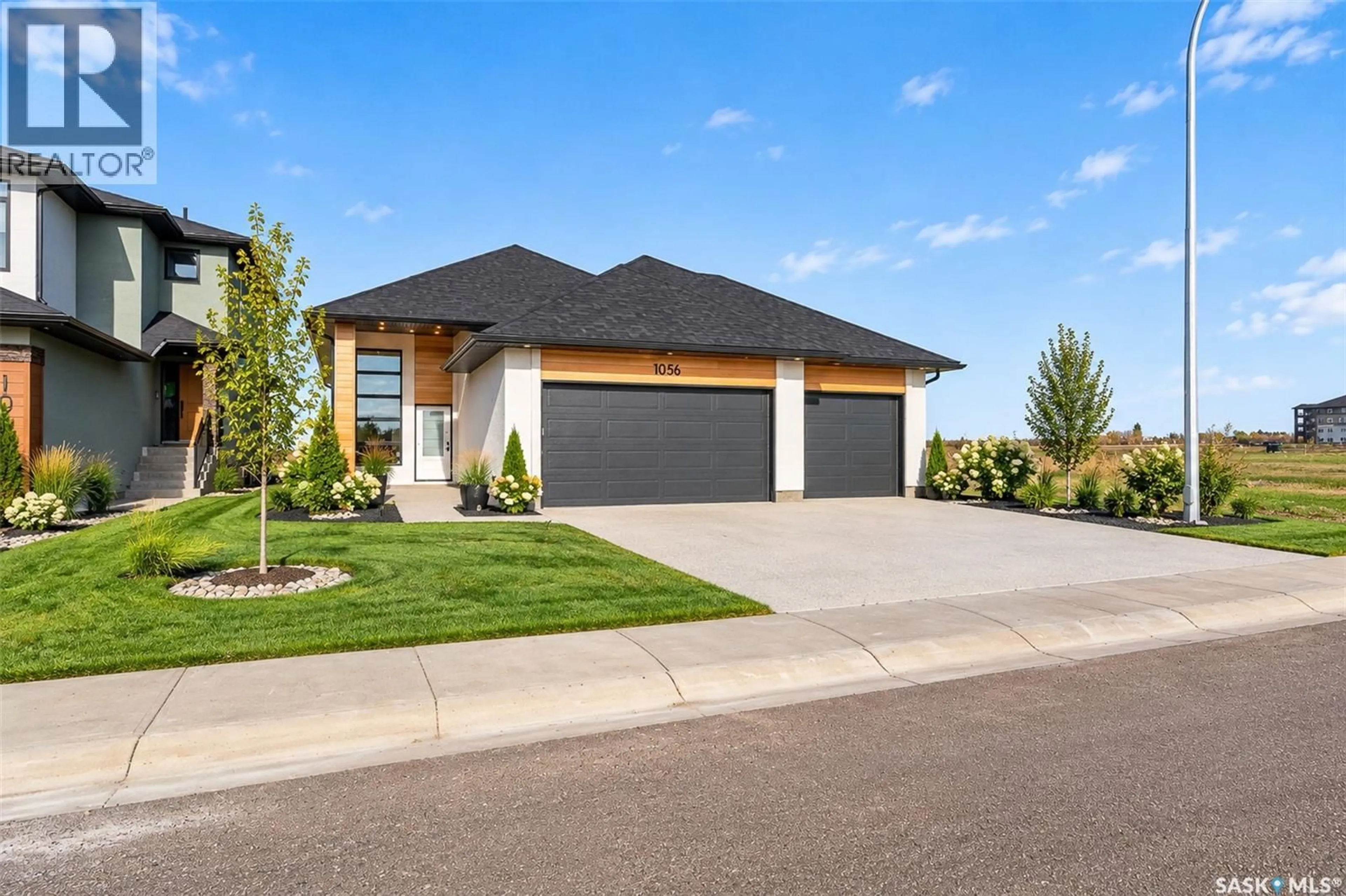 Home with brick exterior material, street for 1056 WEST PARK BOULEVARD, Moose Jaw Saskatchewan S6J0E6