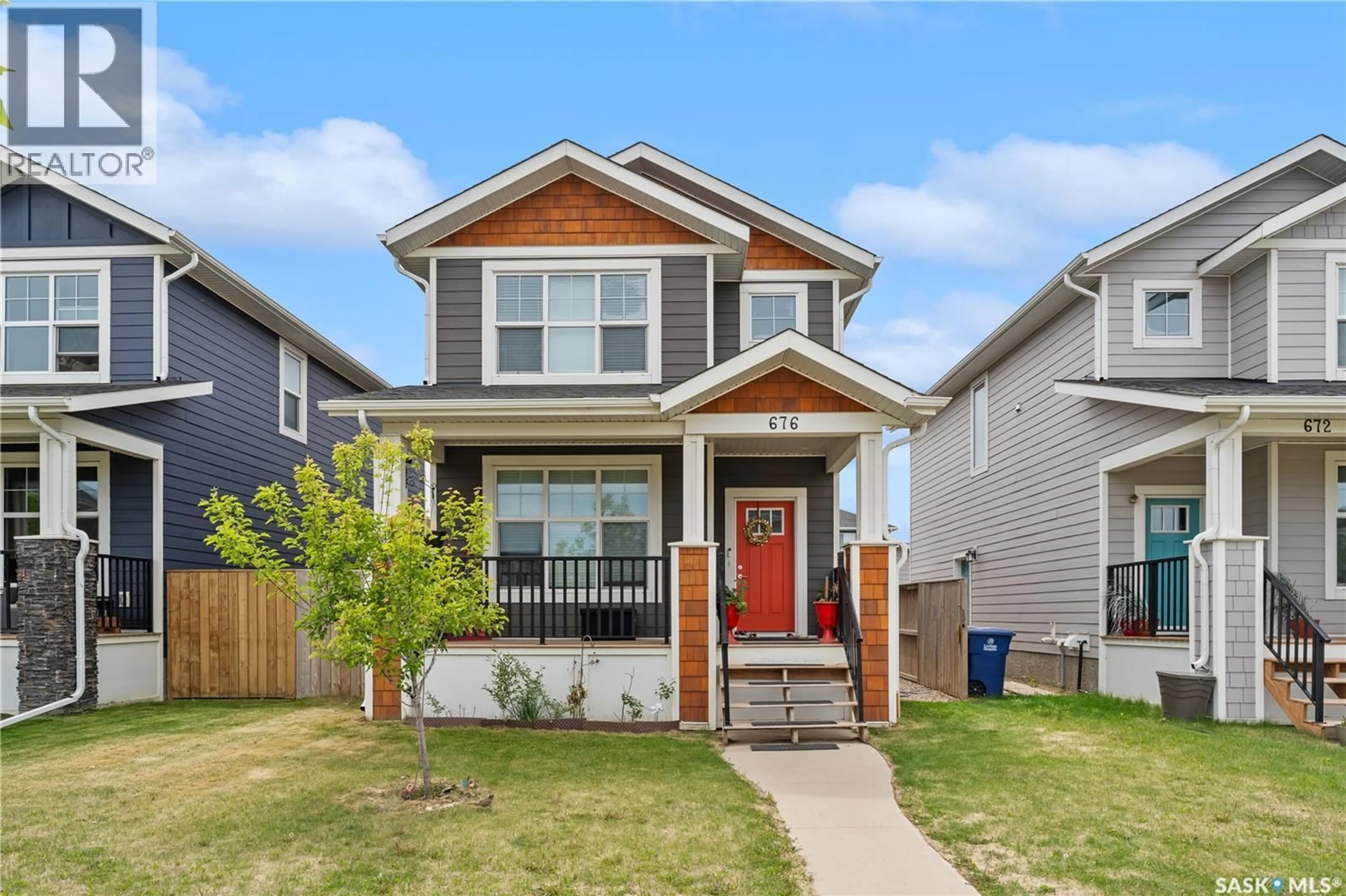 Home with vinyl exterior material, street for 676 MEADOWS BOULEVARD, Saskatoon Saskatchewan S7V0M5