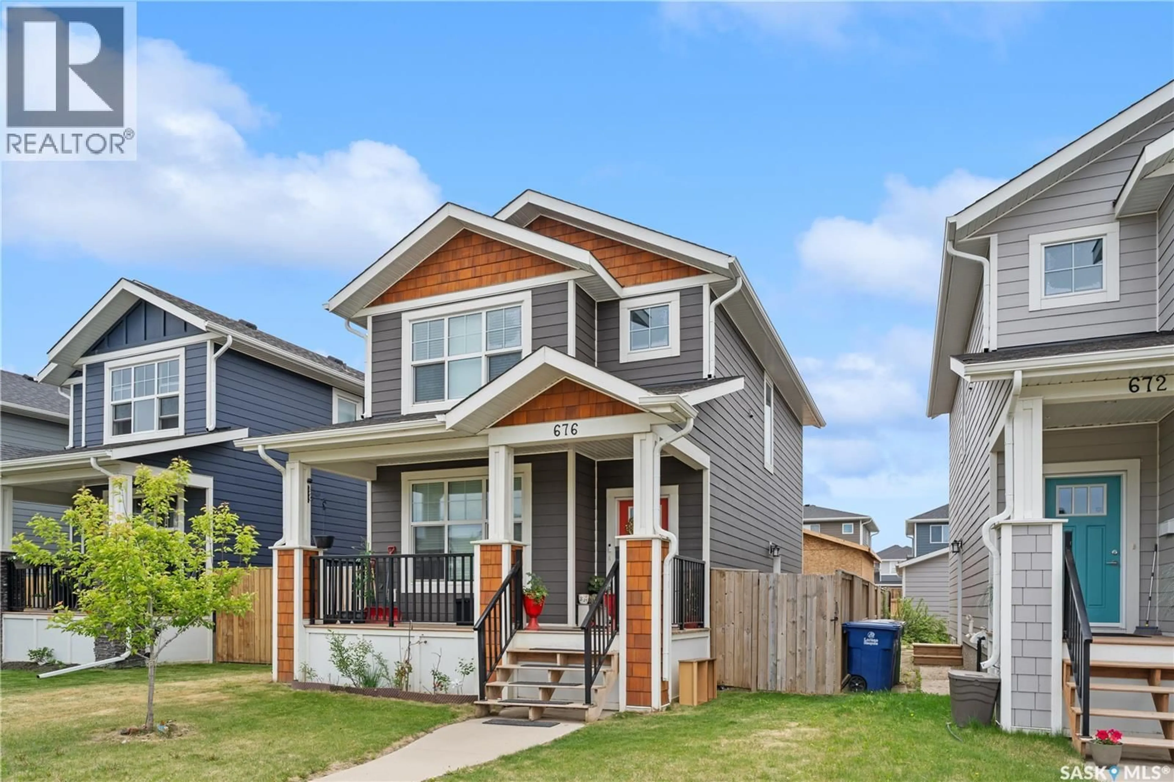 Home with vinyl exterior material, street for 676 MEADOWS BOULEVARD, Saskatoon Saskatchewan S7V0M5