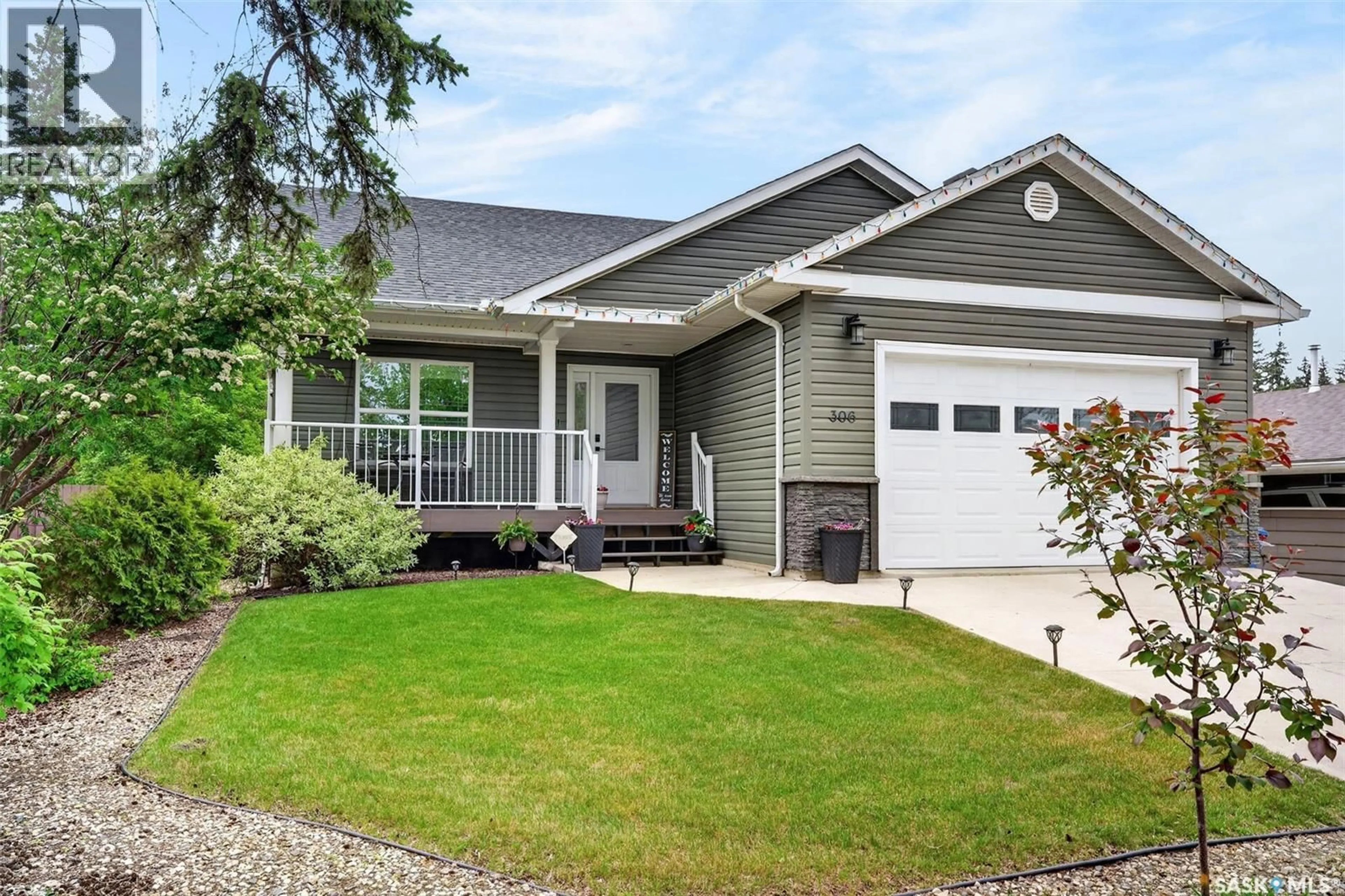 Home with vinyl exterior material, street for E - 306 BURROWS AVENUE, Melfort Saskatchewan S0E1A0