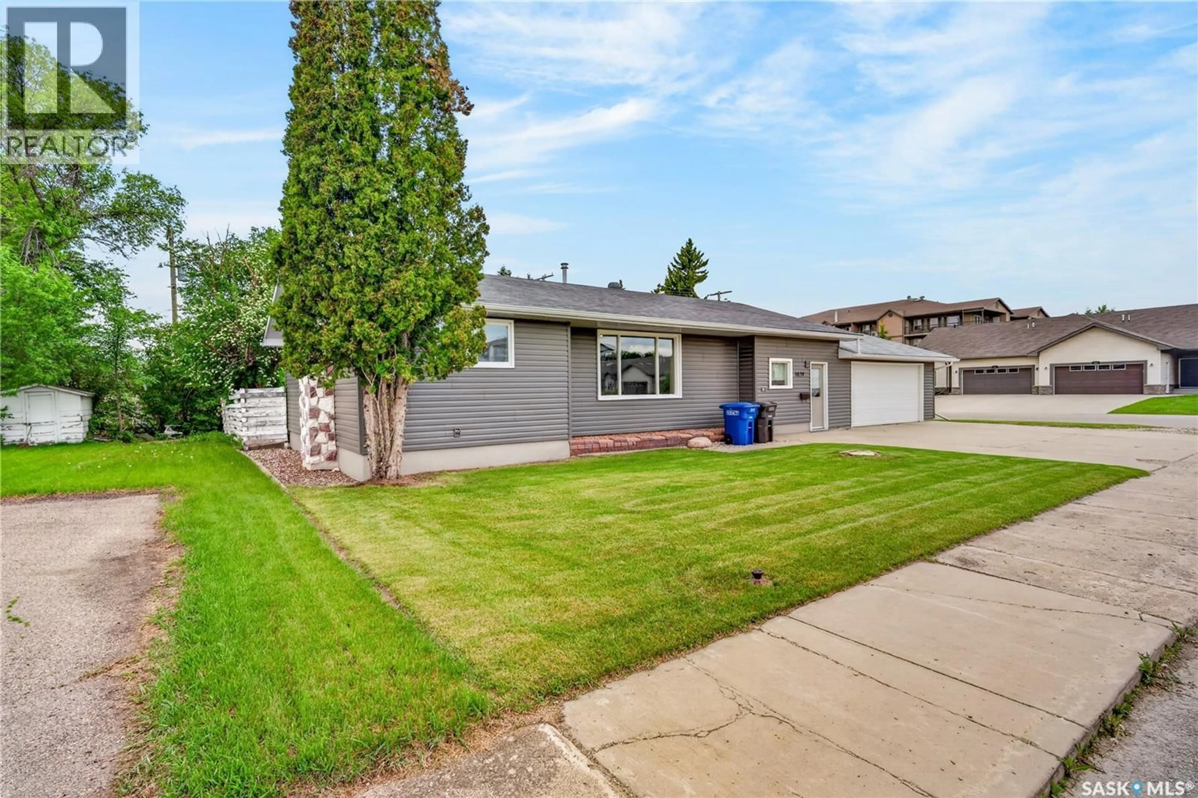 Home with vinyl exterior material, street for 1039 7TH STREET, Humboldt Saskatchewan S0K2A0