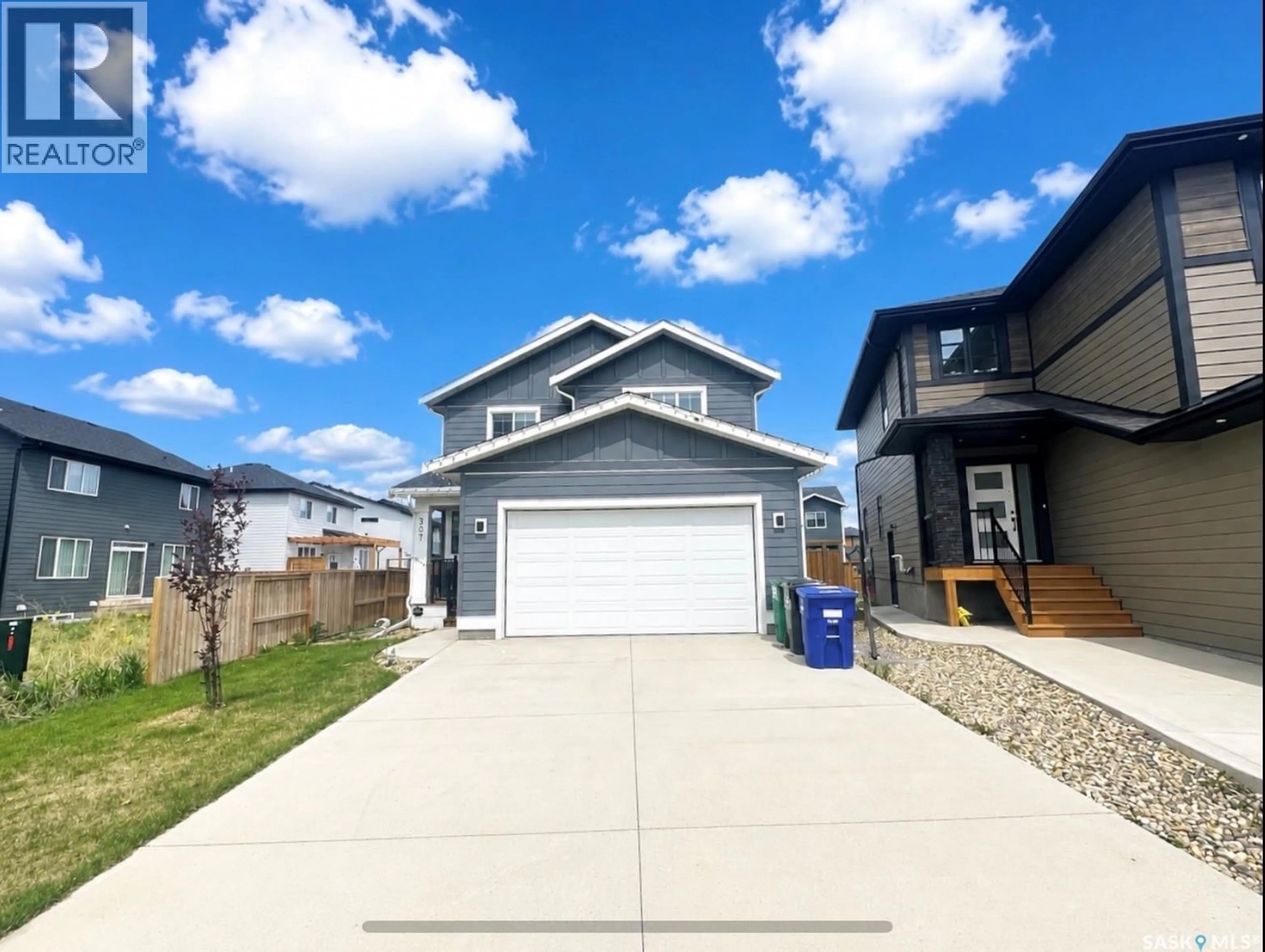 Home with vinyl exterior material, street for 307 KEITH UNION, Saskatoon Saskatchewan S7V0X9