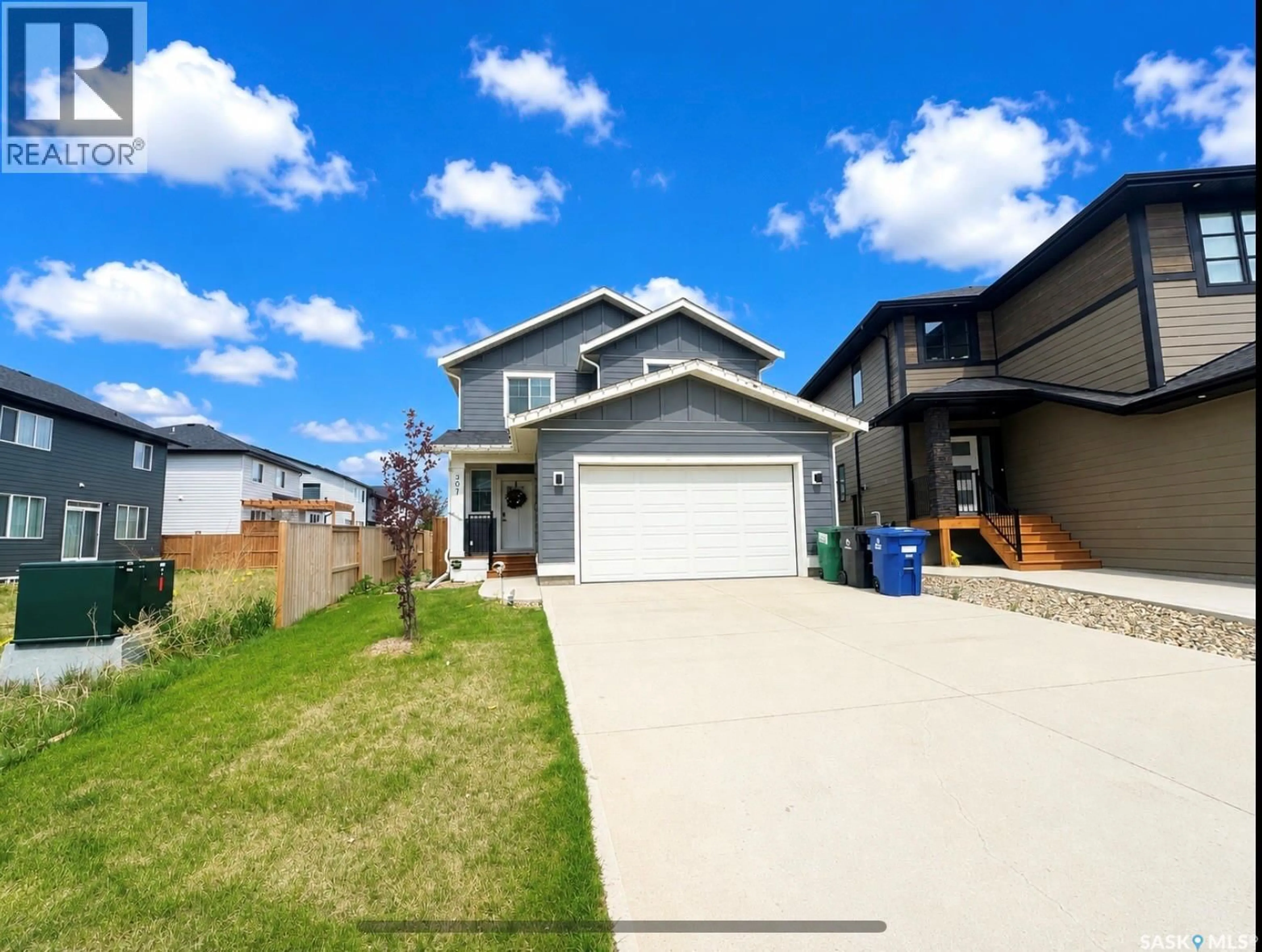 Home with vinyl exterior material, street for 307 KEITH UNION, Saskatoon Saskatchewan S7V0X9