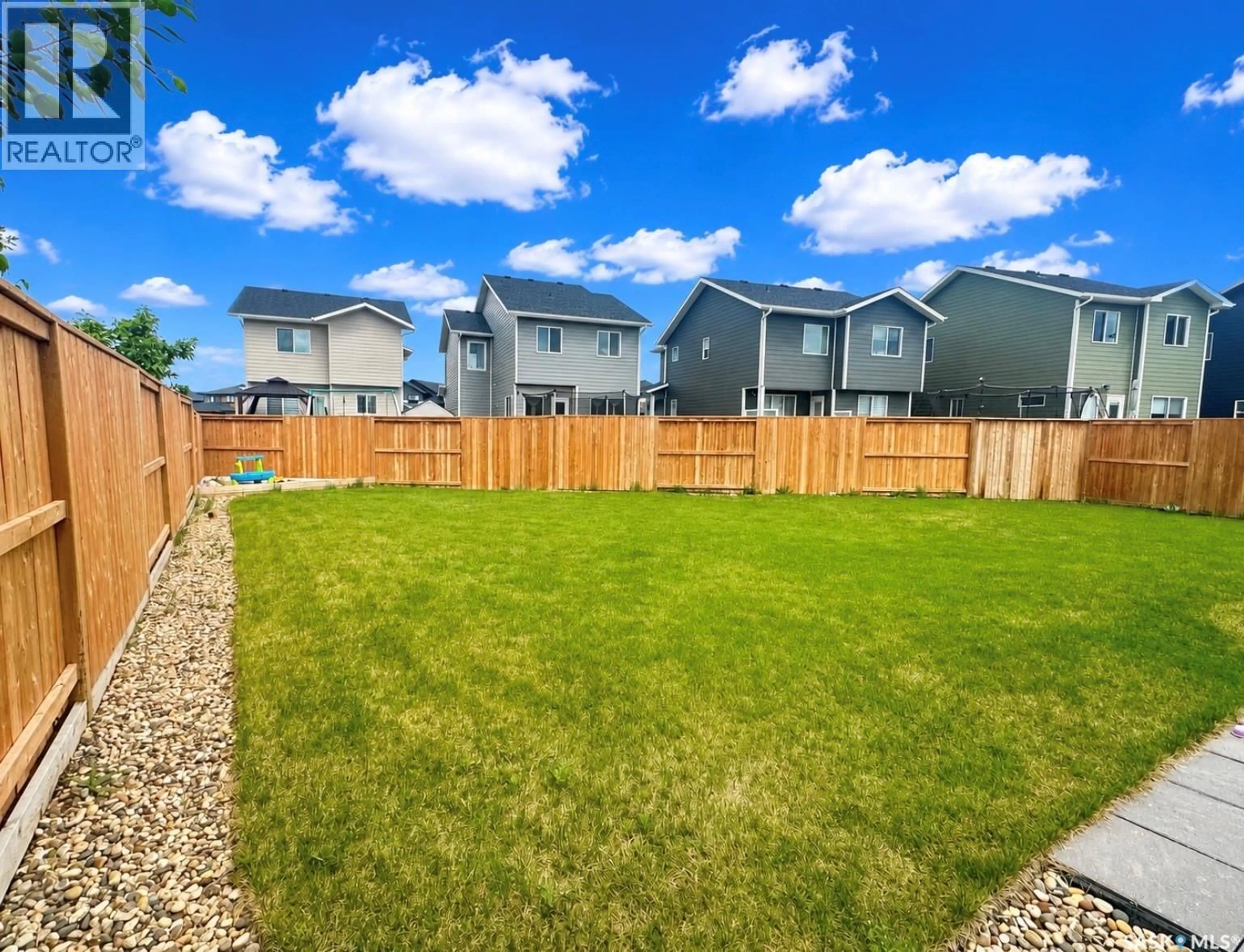 A pic from outside/outdoor area/front of a property/back of a property/a pic from drone, street for 307 KEITH UNION, Saskatoon Saskatchewan S7V0X9