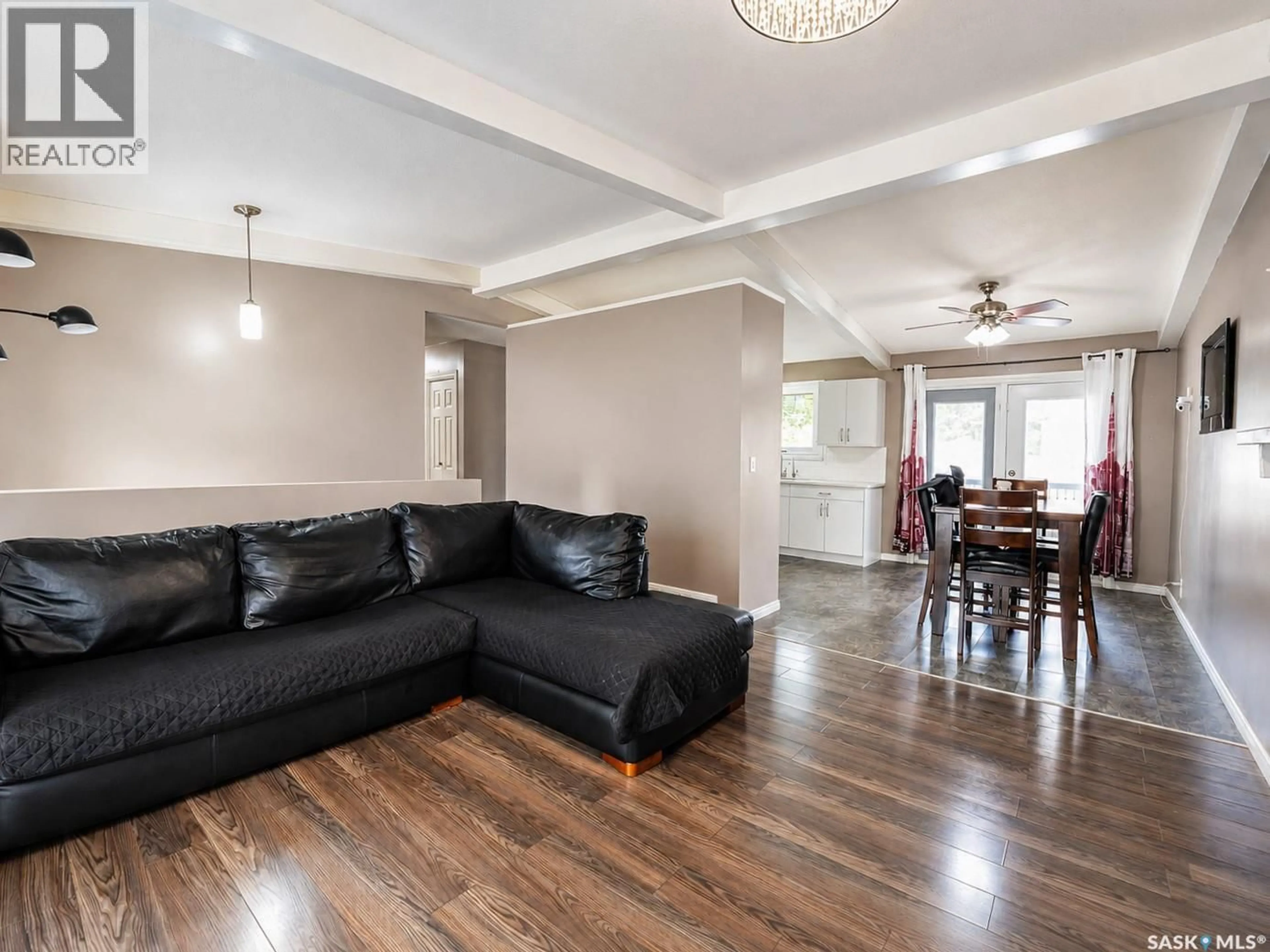Living room with furniture, wood/laminate floor for 277 CANNON STREET, Regina Saskatchewan S4N4V4