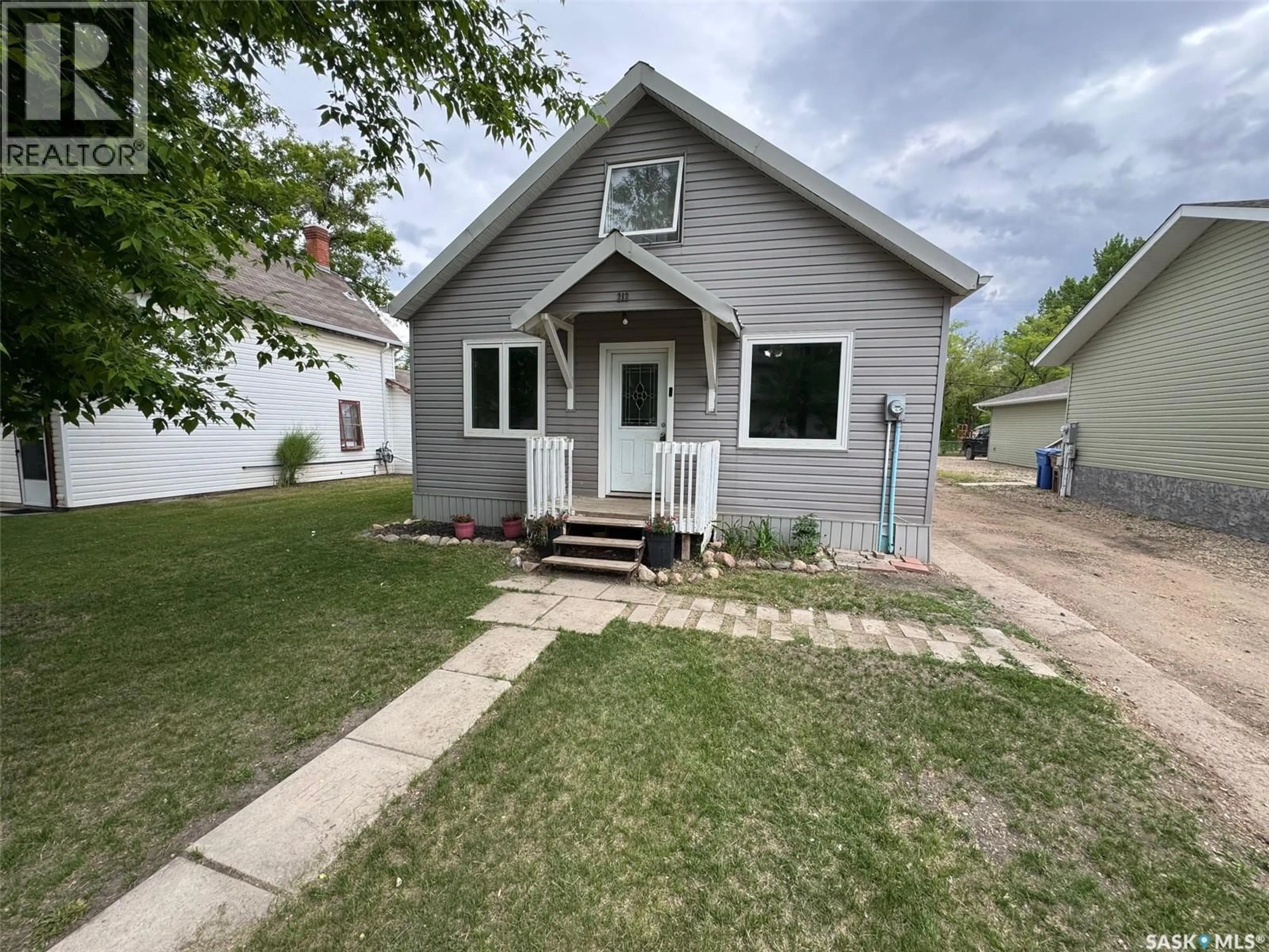 Home with vinyl exterior material, street for 212 CRAWFORD AVENUE, Melfort Saskatchewan S0E1A0