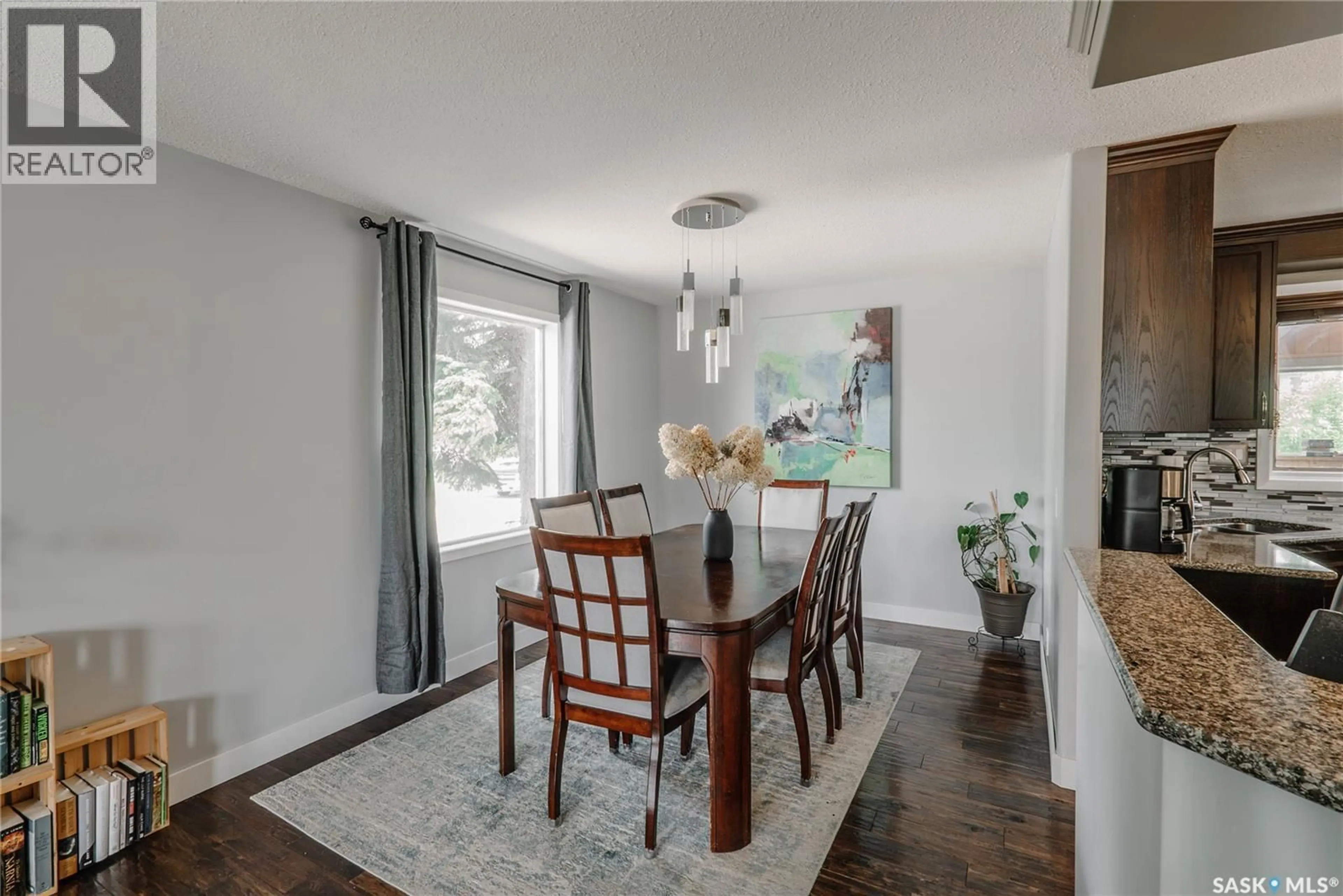 Dining room, wood/laminate floor for 335 THAIN CRESCENT, Saskatoon Saskatchewan S7K6N1