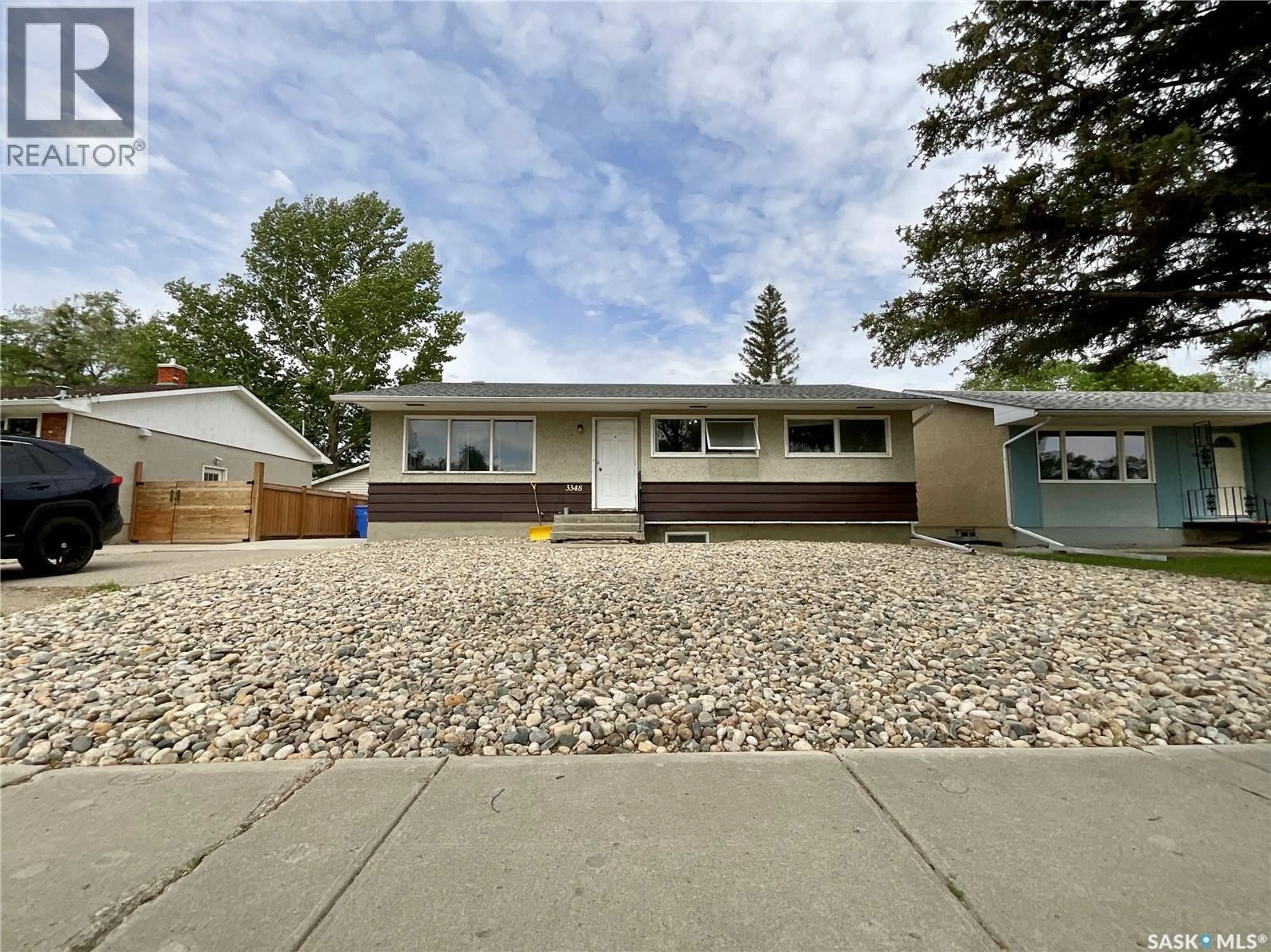Home with vinyl exterior material, street for 3348 GRANT ROAD, Regina Saskatchewan S4S5H5