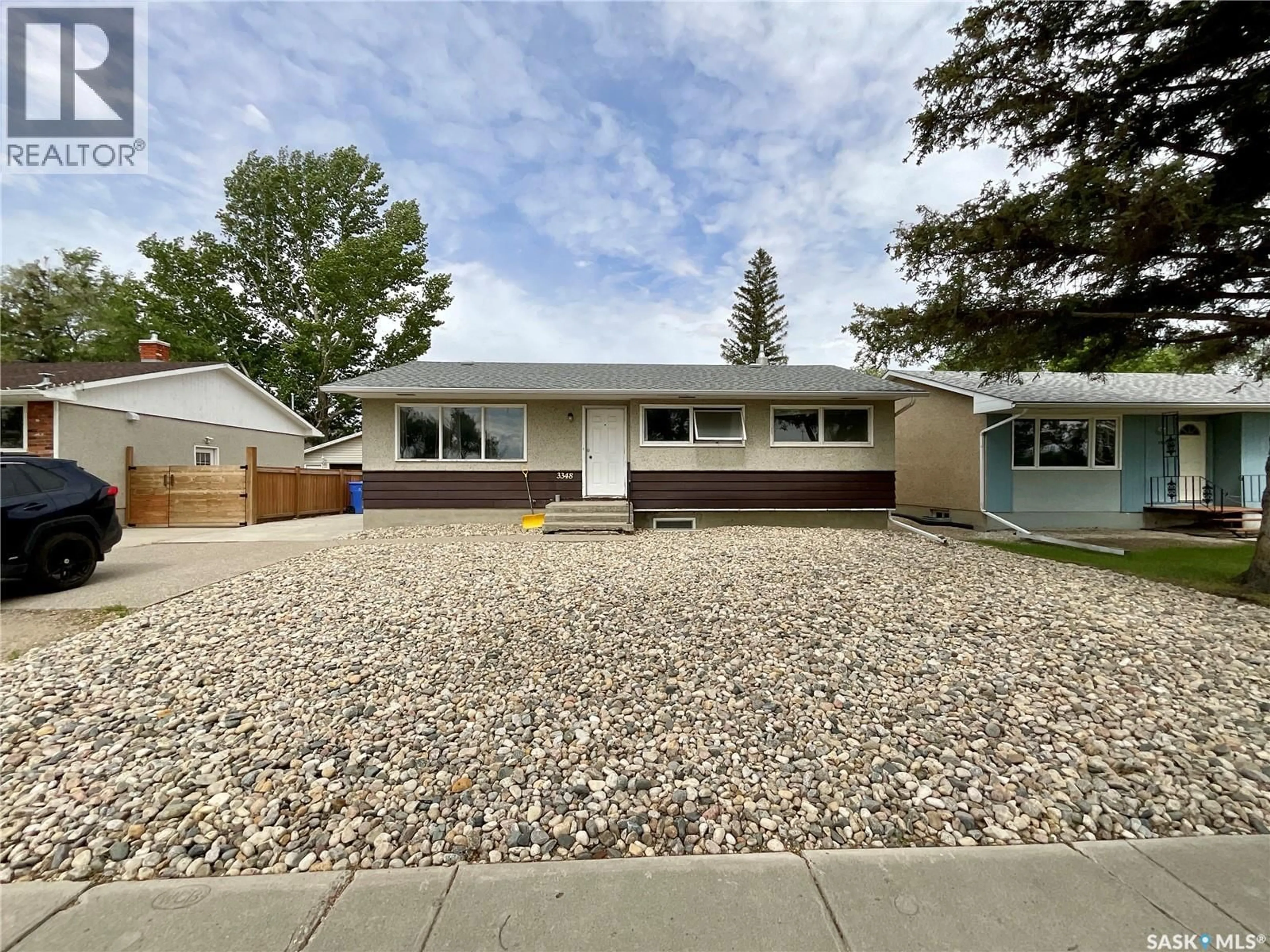 Home with vinyl exterior material, street for 3348 GRANT ROAD, Regina Saskatchewan S4S5H5
