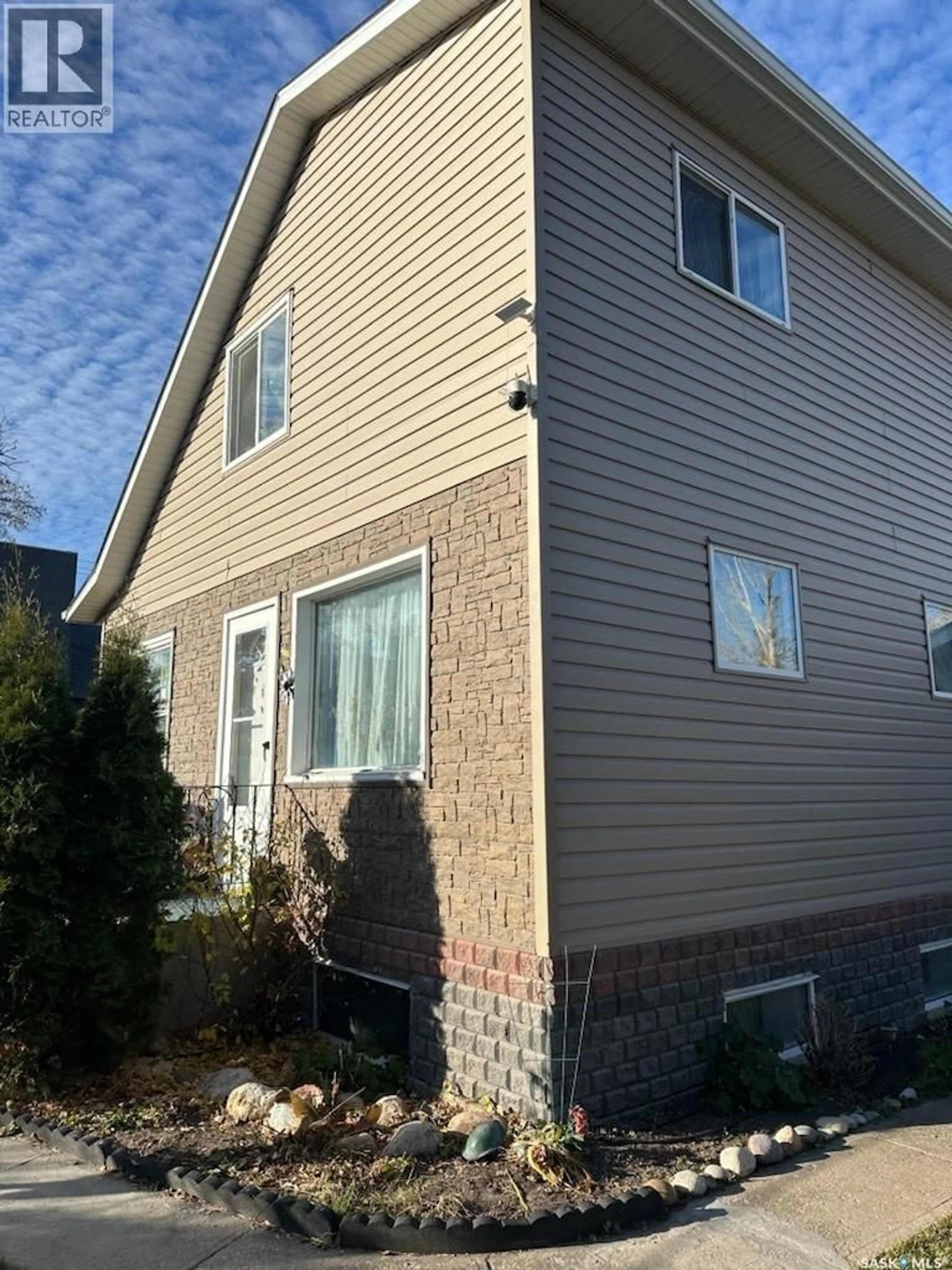Home with vinyl exterior material, street for 2216 20TH STREET, Saskatoon Saskatchewan S7M1B1