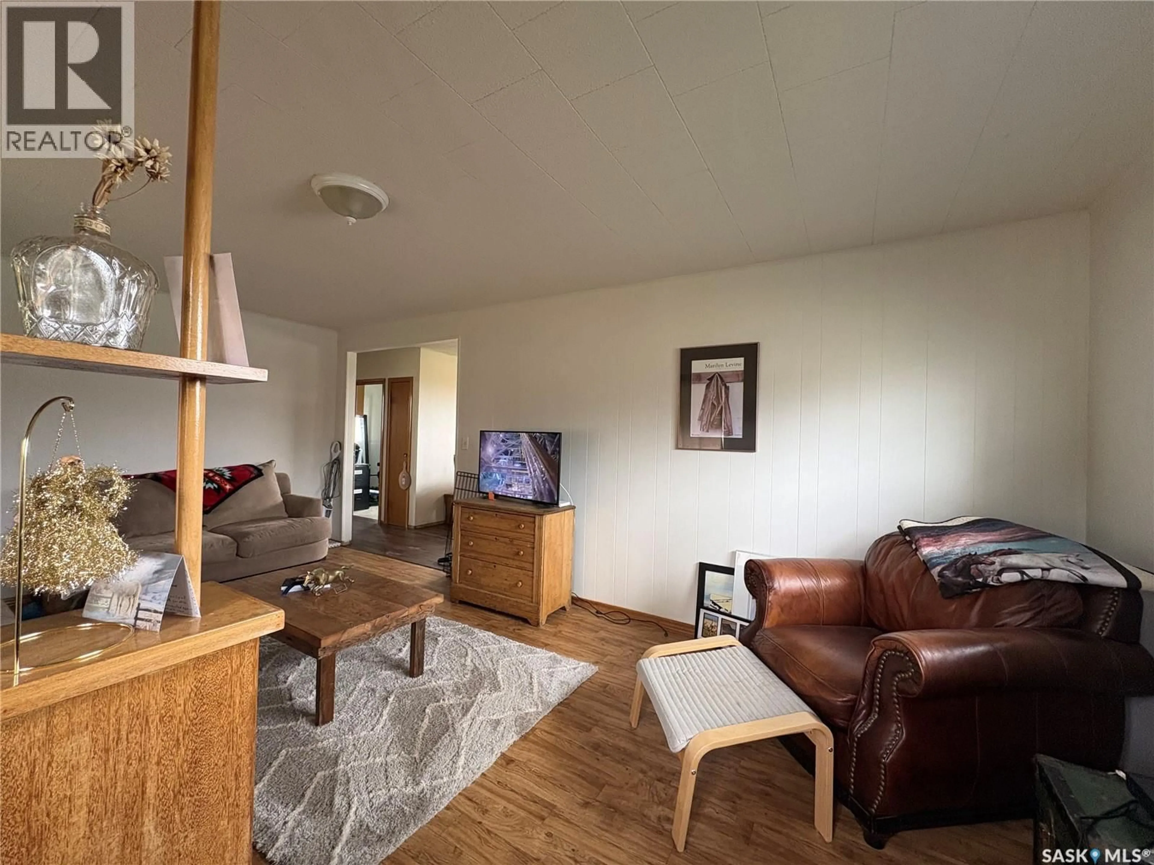Living room with furniture, wood/laminate floor for ROWAN ACREAGE, Ituna Bon Accord Rm No. 246 Saskatchewan S0A1N0