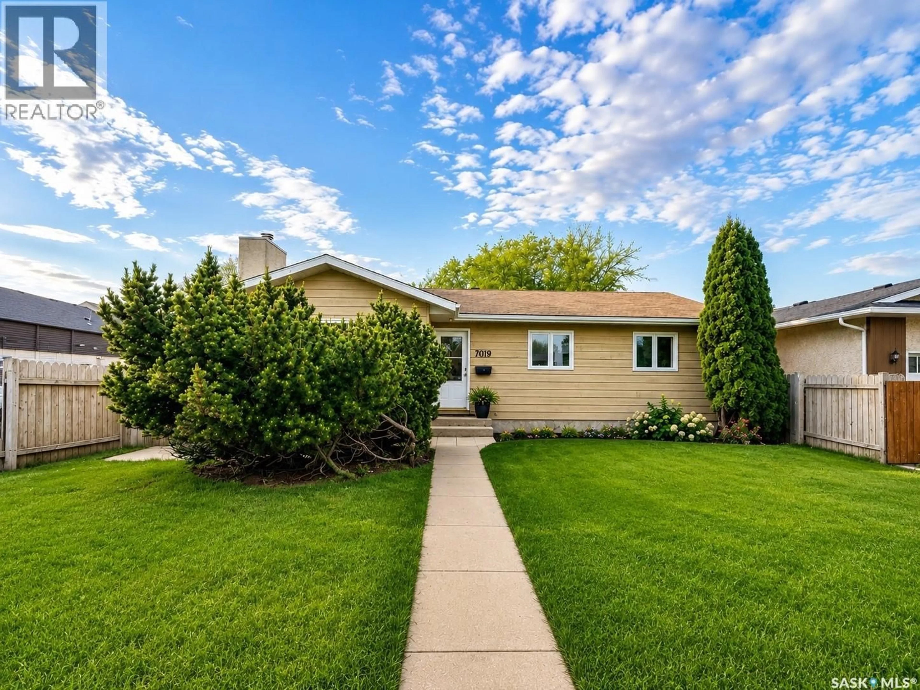 Home with vinyl exterior material, street for 7019 SHERWOOD DRIVE, Regina Saskatchewan S4X2V5