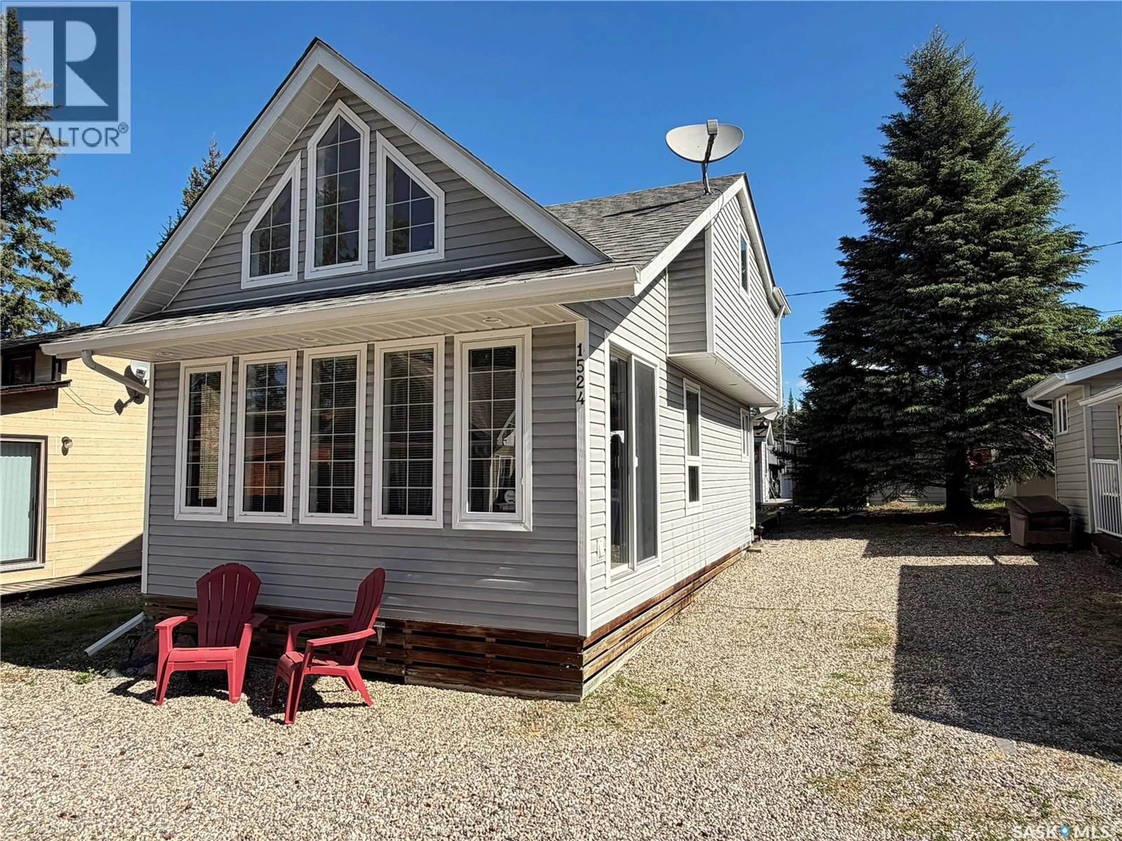 Home with vinyl exterior material, street for 1524 CHICKADEE STREET, Prince Albert National Park Saskatchewan S0J2Y0