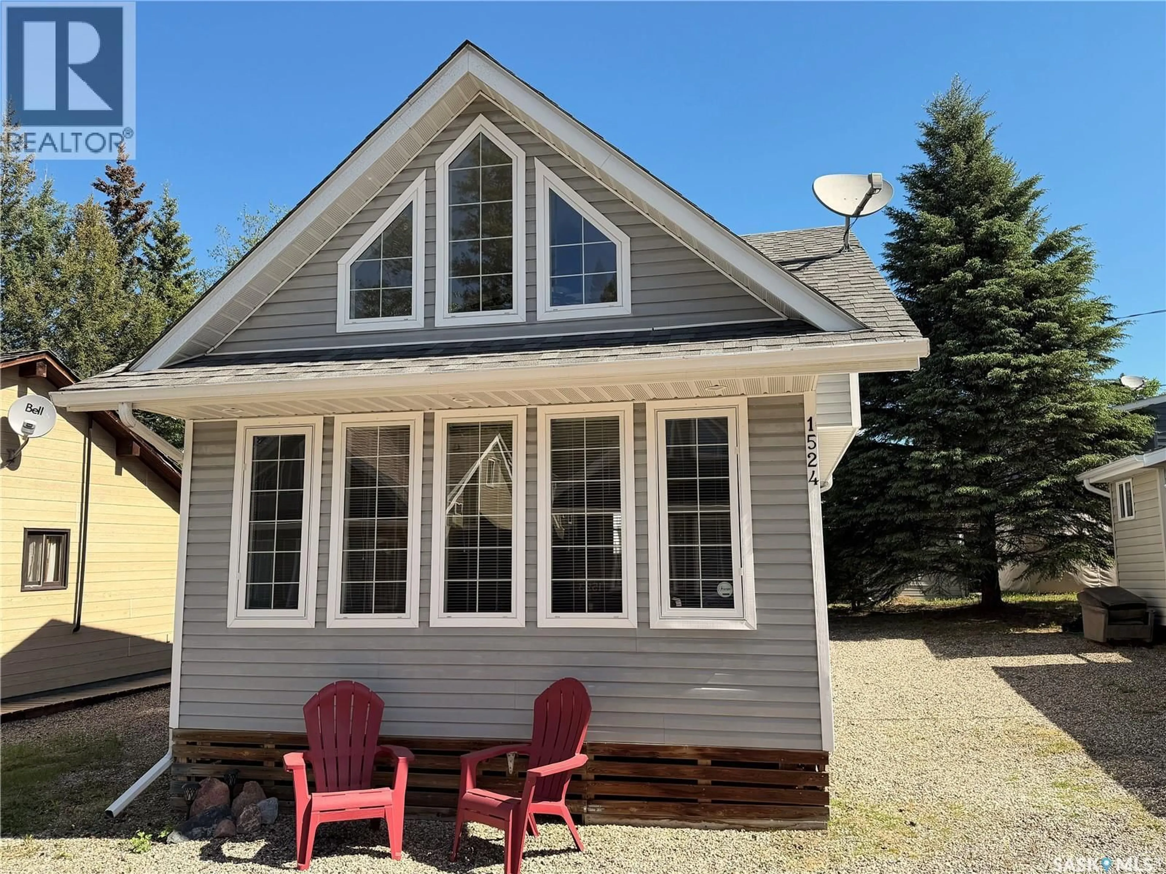 Home with vinyl exterior material, street for 1524 CHICKADEE STREET, Prince Albert National Park Saskatchewan S0J2Y0