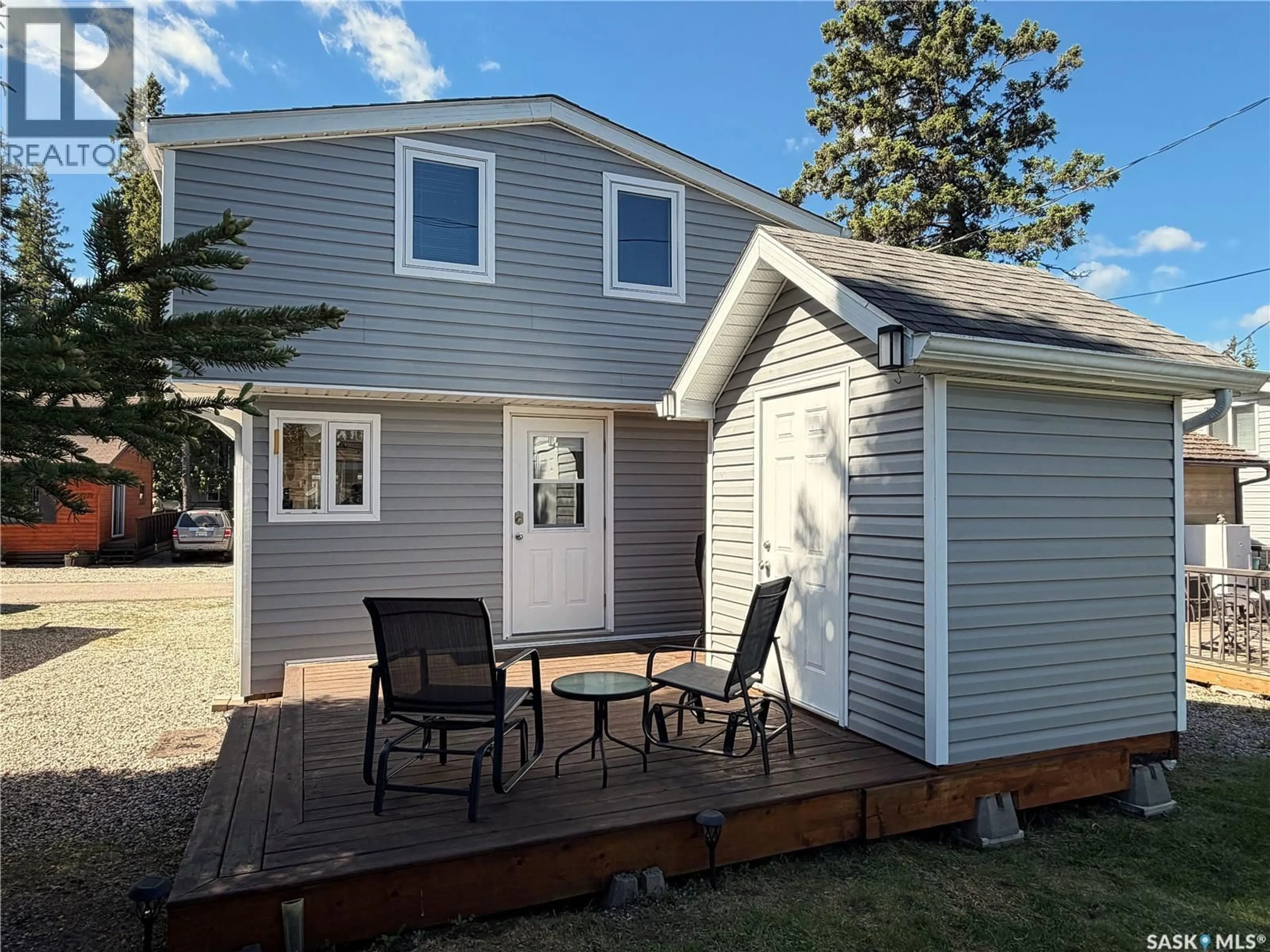 Home with vinyl exterior material, street for 1524 CHICKADEE STREET, Prince Albert National Park Saskatchewan S0J2Y0