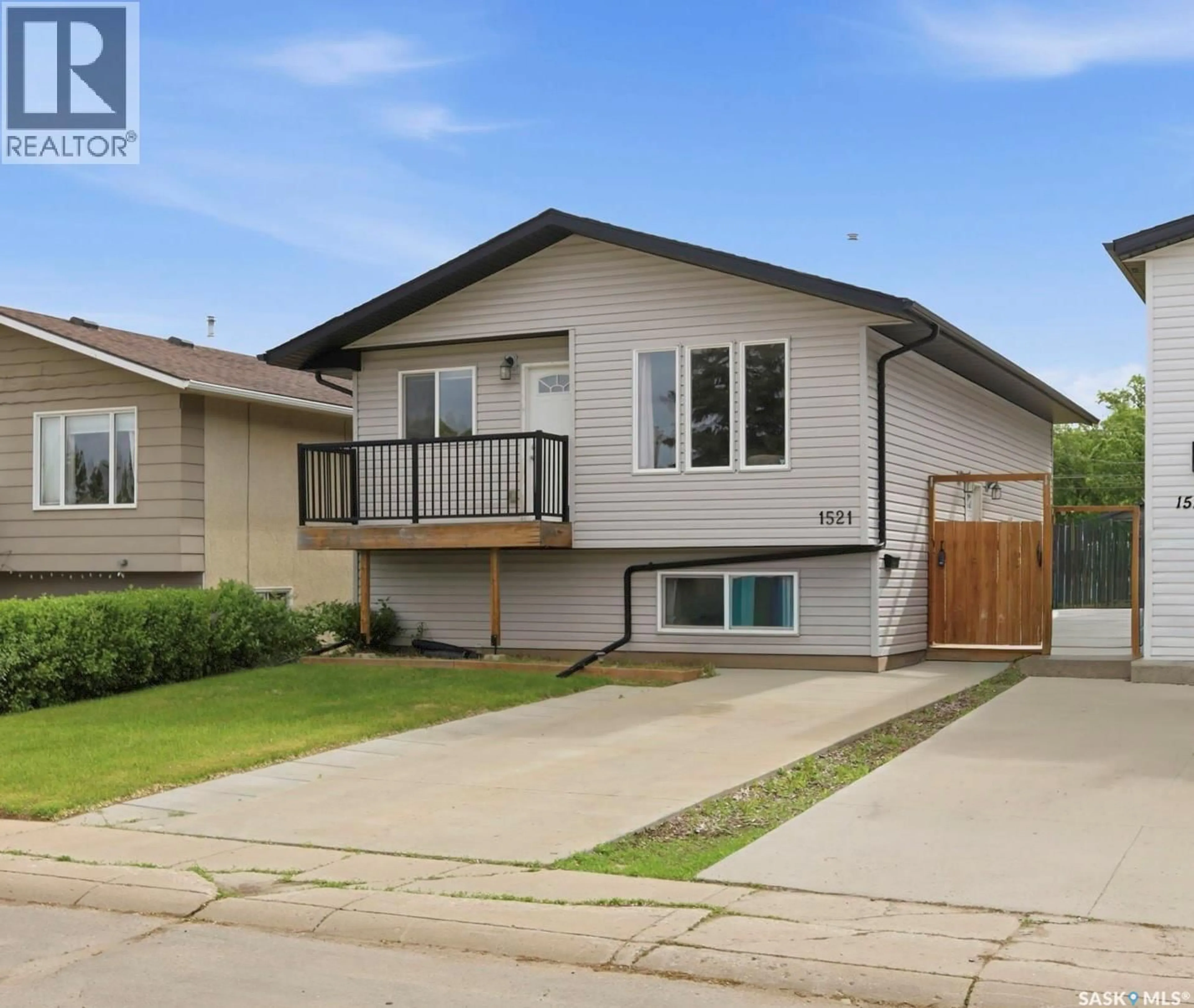 Home with vinyl exterior material, street for 1521 LAURA AVENUE, Saskatoon Saskatchewan S7N2R8