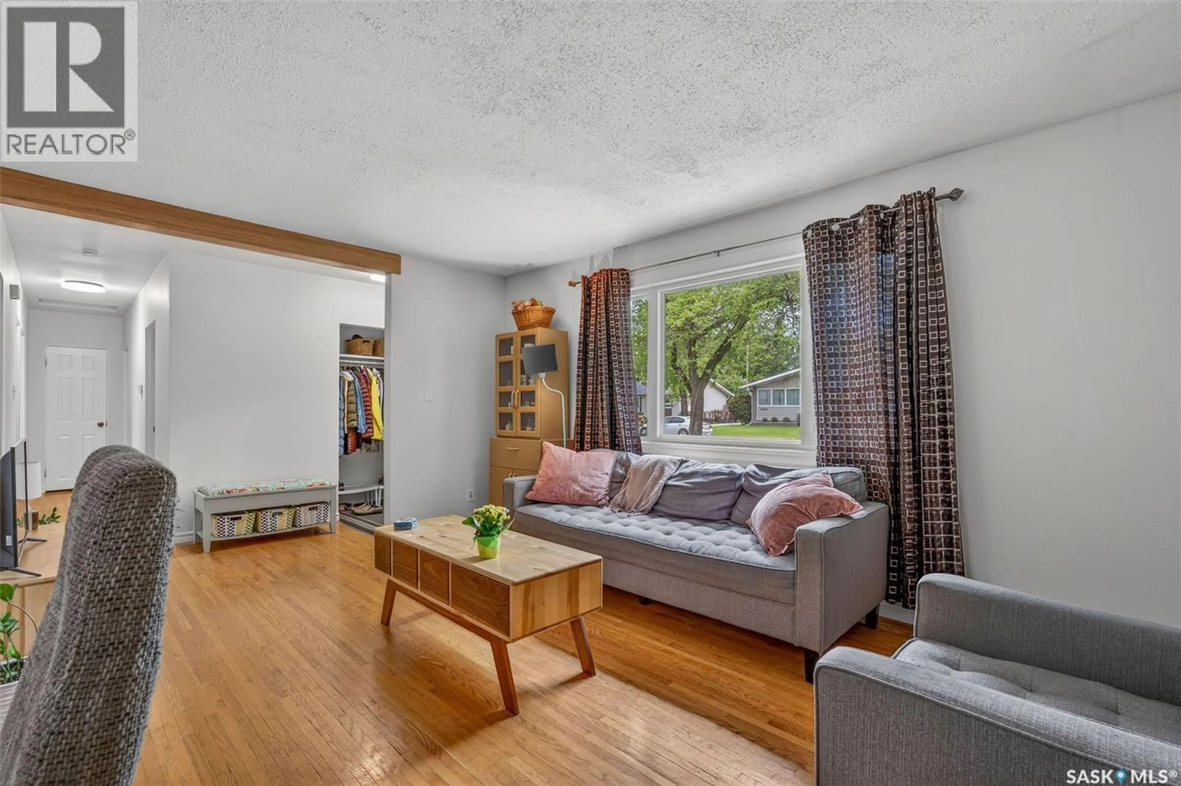 Living room with furniture, wood/laminate floor for 2326 MCDONALD AVENUE, Prince Albert Saskatchewan S6V2V6