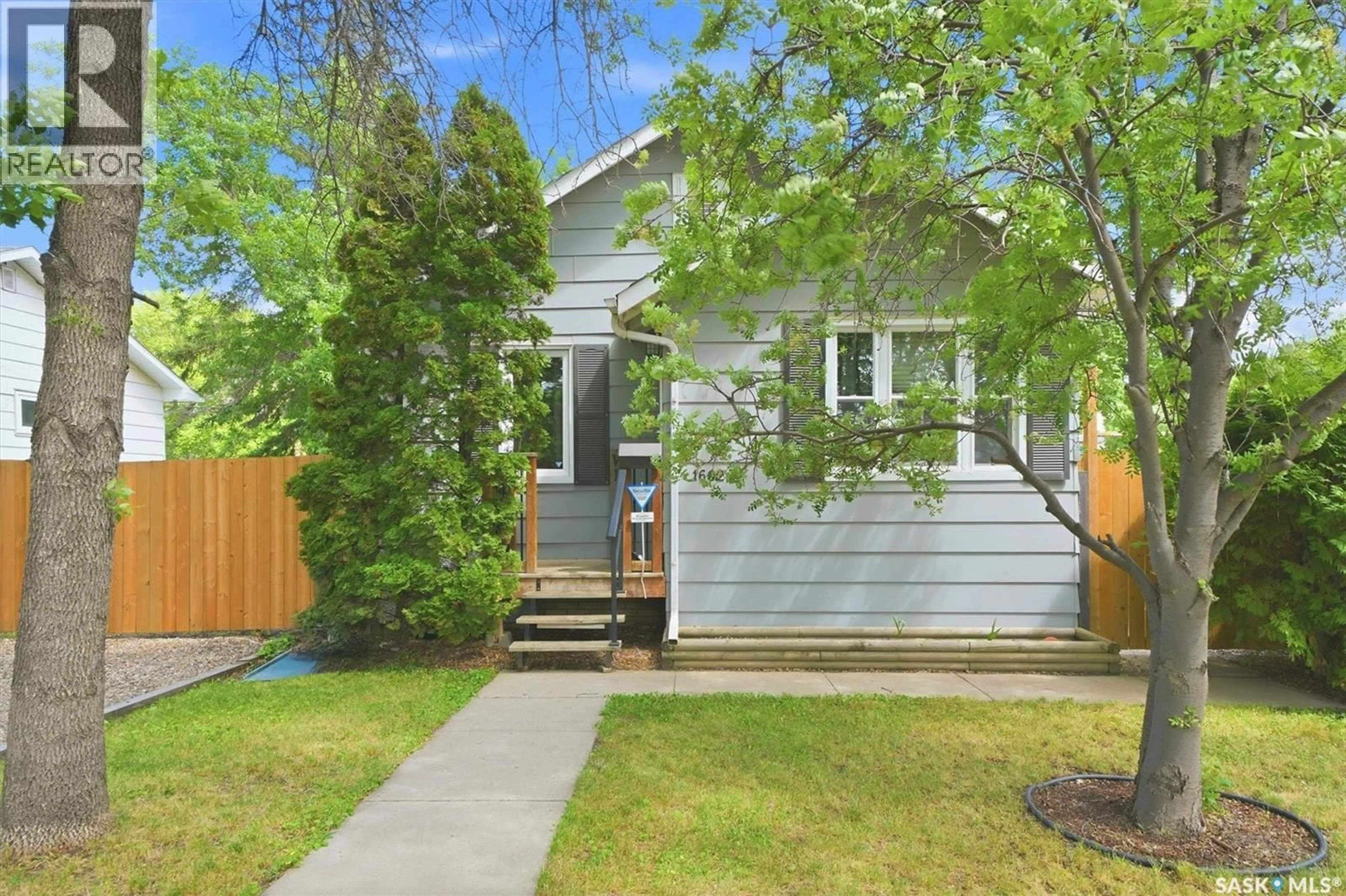 Home with vinyl exterior material, street for 1602 C AVENUE, Saskatoon Saskatchewan S7L1L5