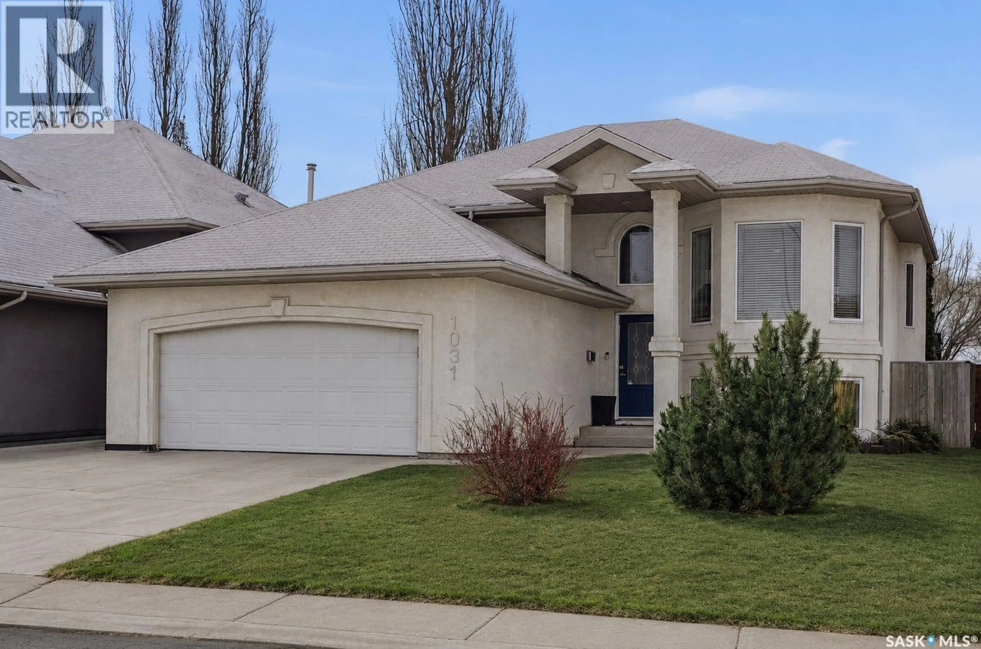 Home with vinyl exterior material, street for 1031 CARR CRESCENT, Saskatoon Saskatchewan S7S1L8