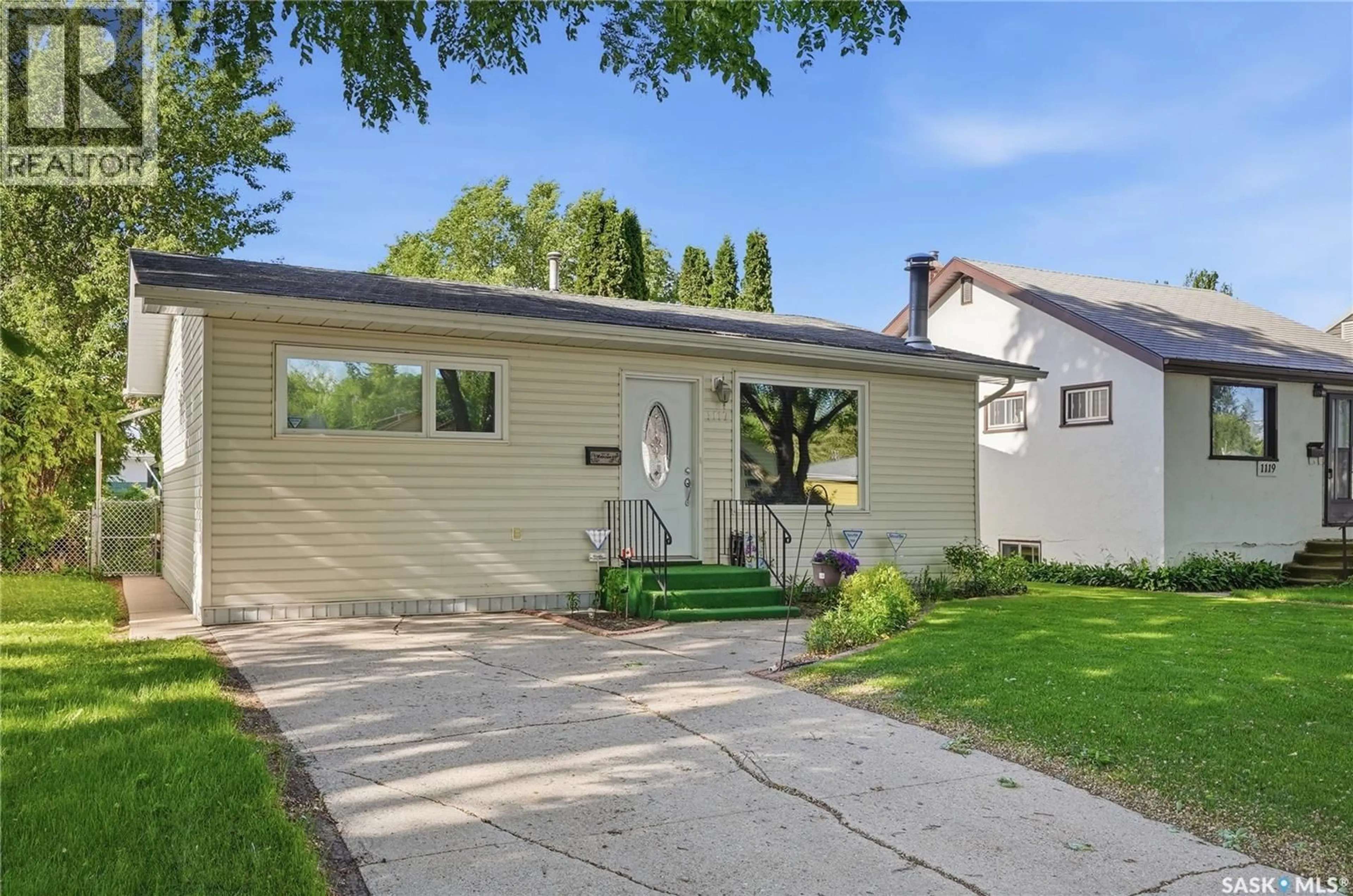 Home with vinyl exterior material, street for 1117 5TH STREET, Saskatoon Saskatchewan S7H1H4