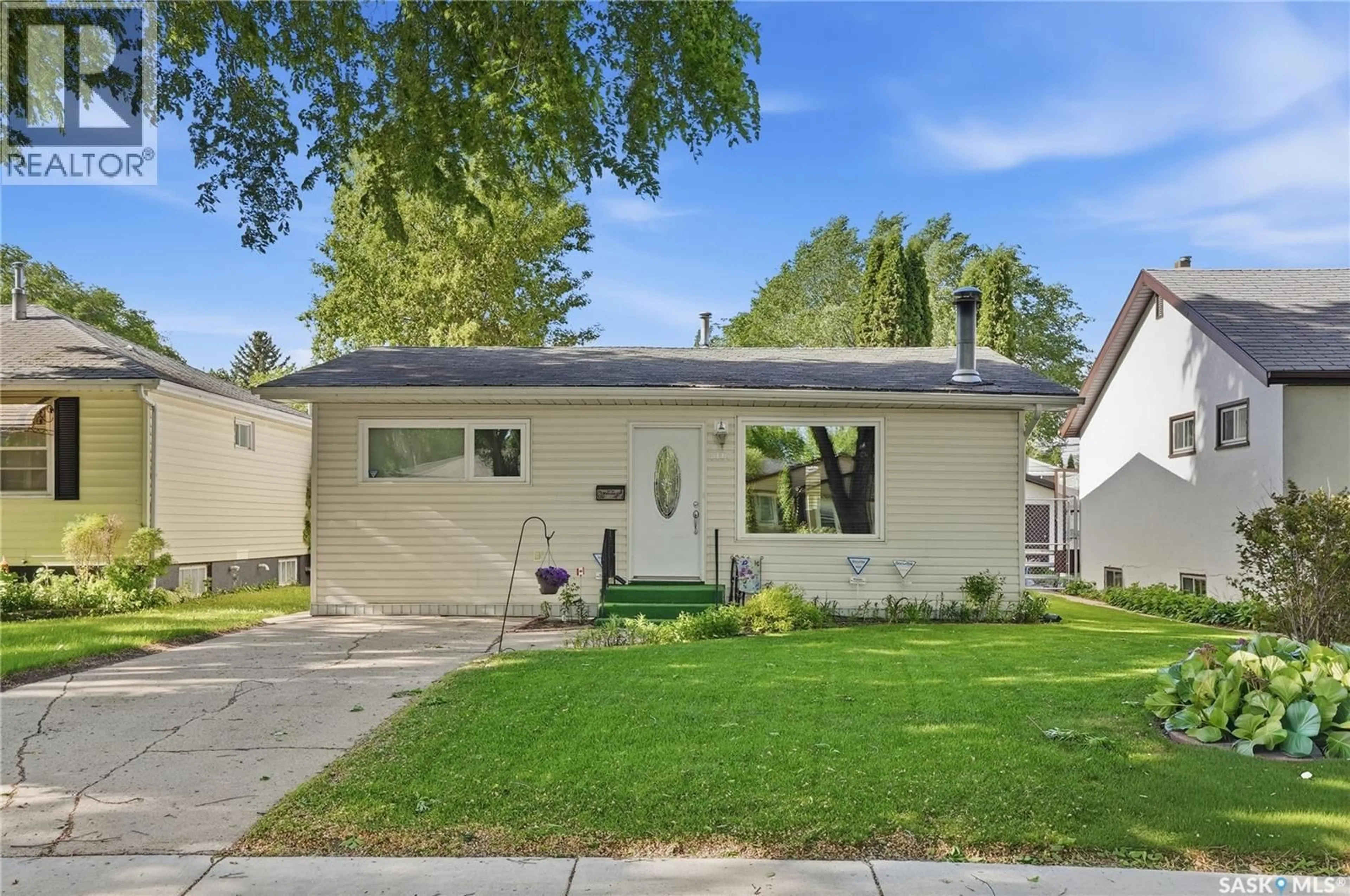 Home with vinyl exterior material, street for 1117 5TH STREET, Saskatoon Saskatchewan S7H1H4